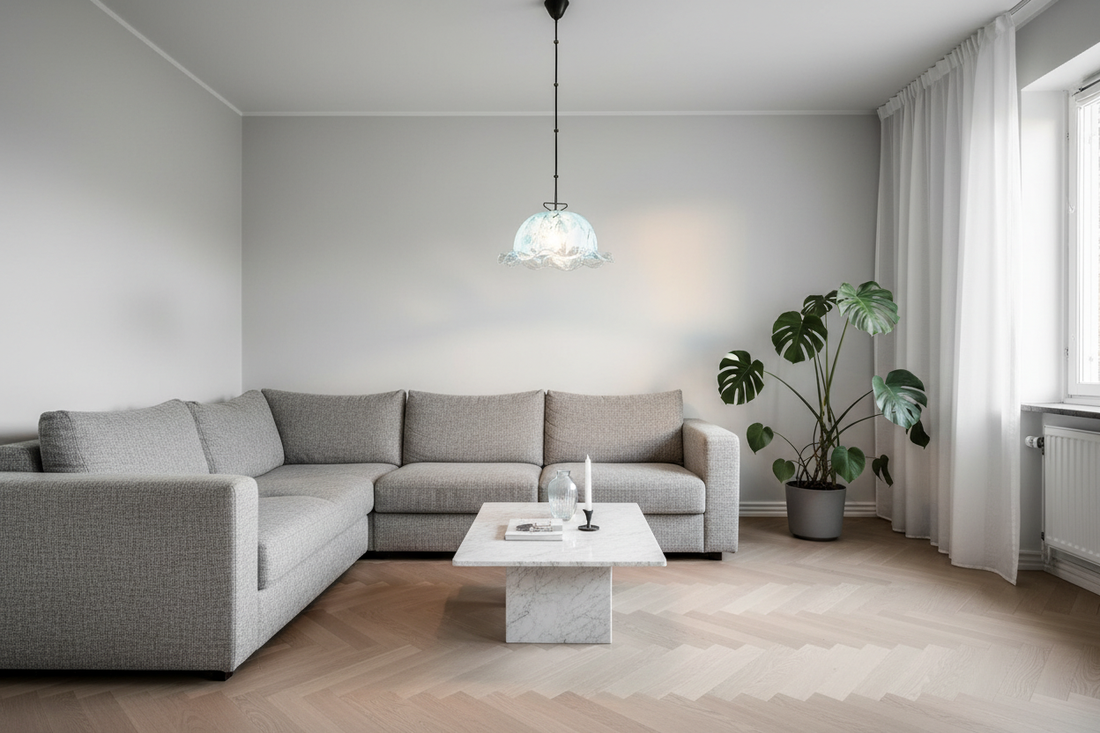 Vintage Murano glass floral pendant light glowing in a minimalist millennial grey Scandinavian living room