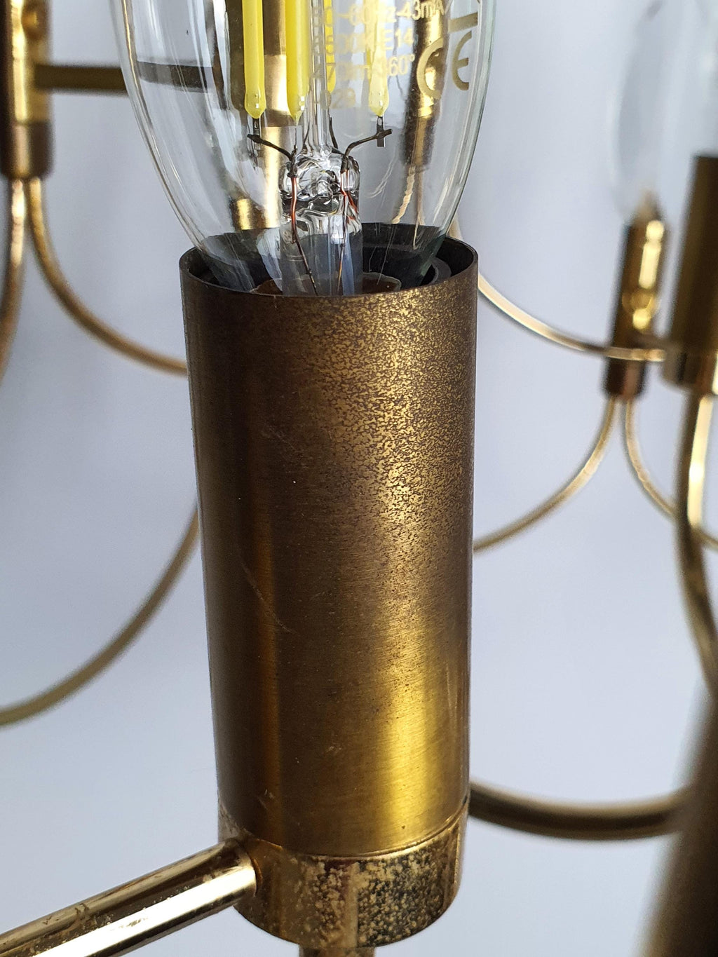 Close-up of faceted crystal drops and double-wave brass motif, vintage Sciolari-attributed chandelier, 1960s–1970s