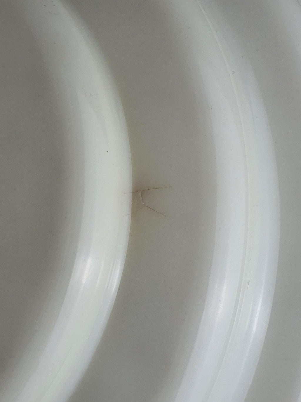 Sirrah Kumo 2 sconce — moulded beige methacrylate shell shape, organic silhouette detail