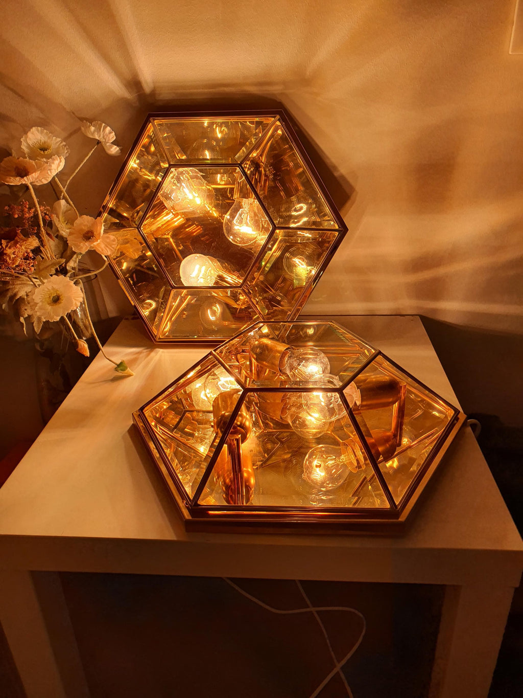 Surface wear and patina detail on gold-toned accents, vintage Italian hexagonal mirror glass light, 1970s Italy