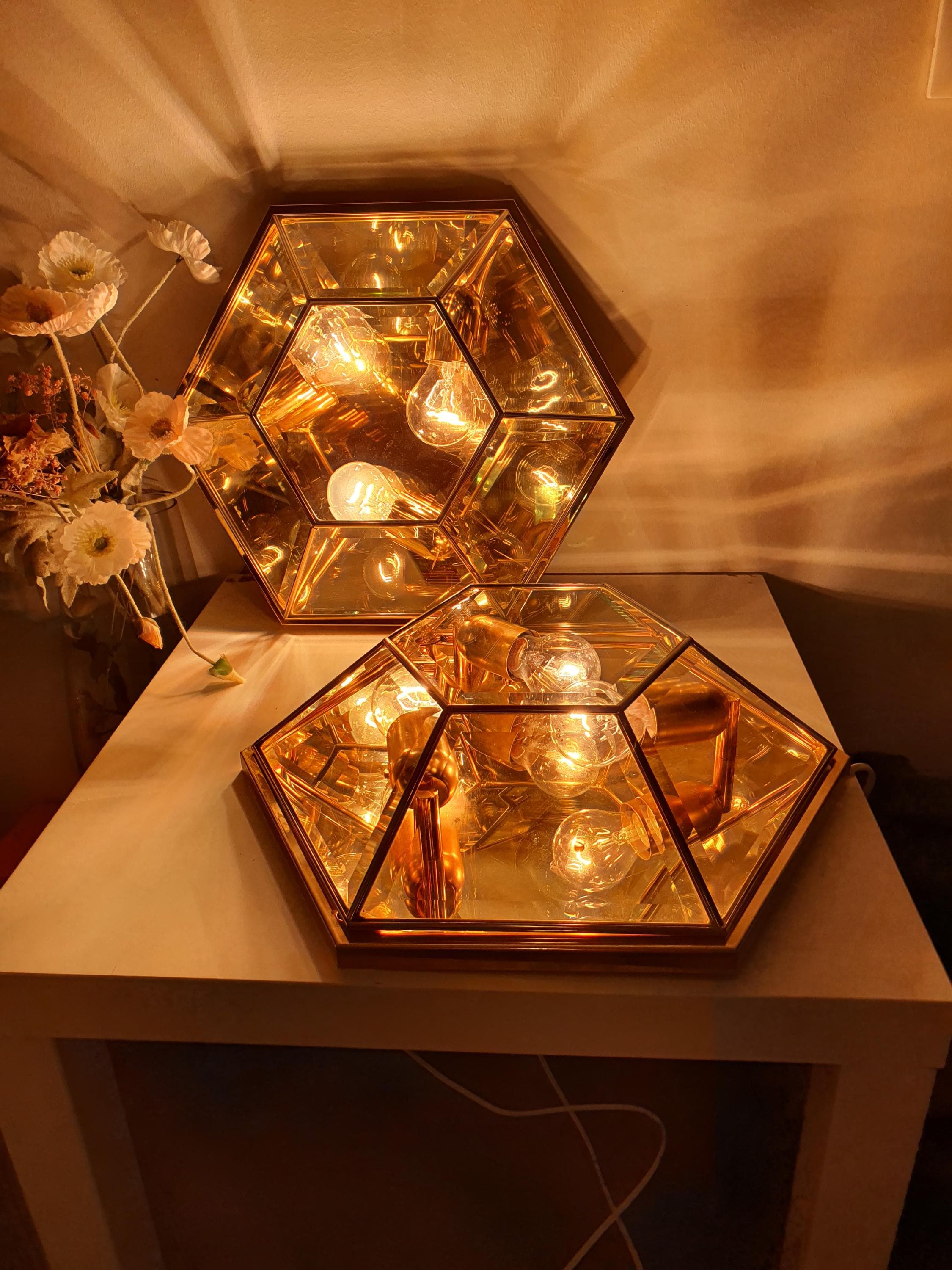 Surface wear and patina detail on gold-toned accents, vintage Italian hexagonal mirror glass light, 1970s Italy