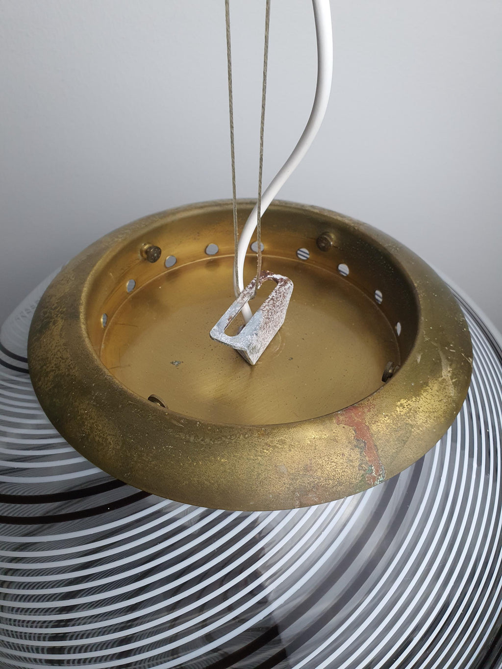 Aged brass fittings on a vintage Italian glass pendant
