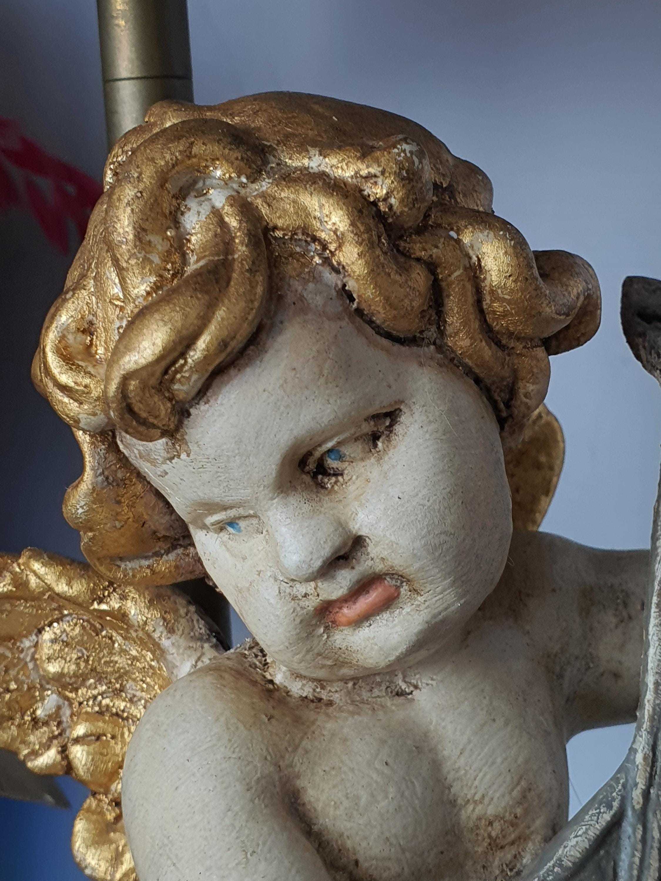 Florentine cherub angel table lamp side profile, painted wooden figure on rocky base, fabric shade, gold accents