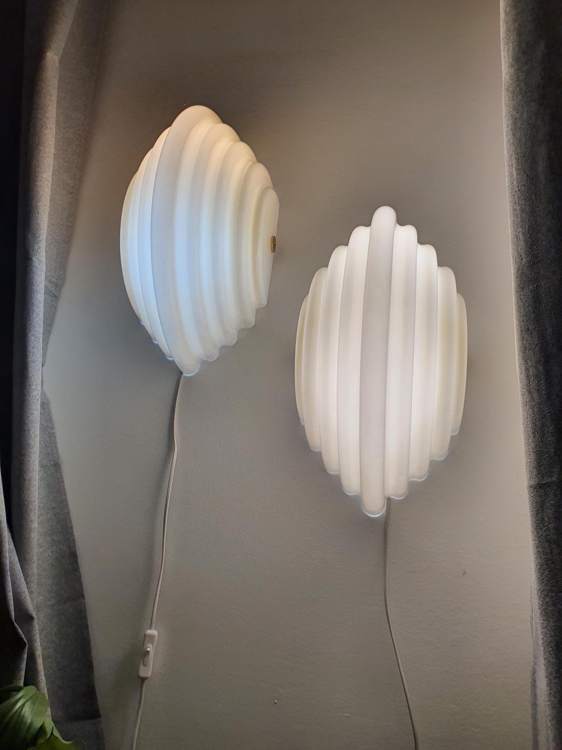 Kazuhide Takahama Kumo 2 wall sconce — smooth acrylic surface and diffused glow