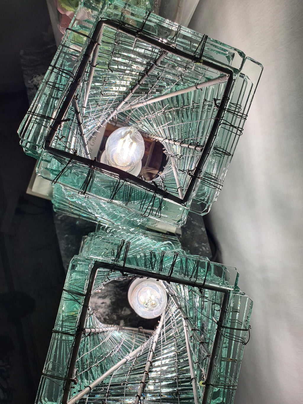 Sculptural twisted glass lamp with a handcrafted mosaic structure
