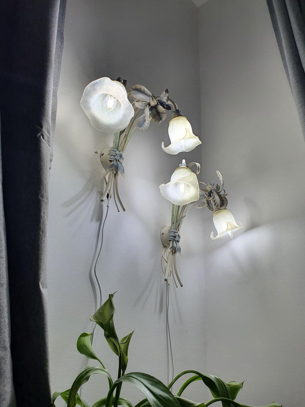Pair of Italian floral wall sconces — both fixtures shown together, romantic interior setting