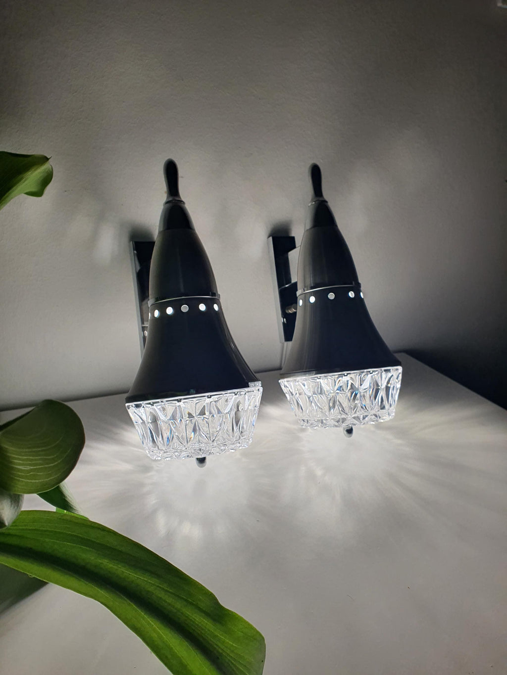 Vintage Brutalist wall sconce — stamped glass shade illuminated, dynamic light reflection