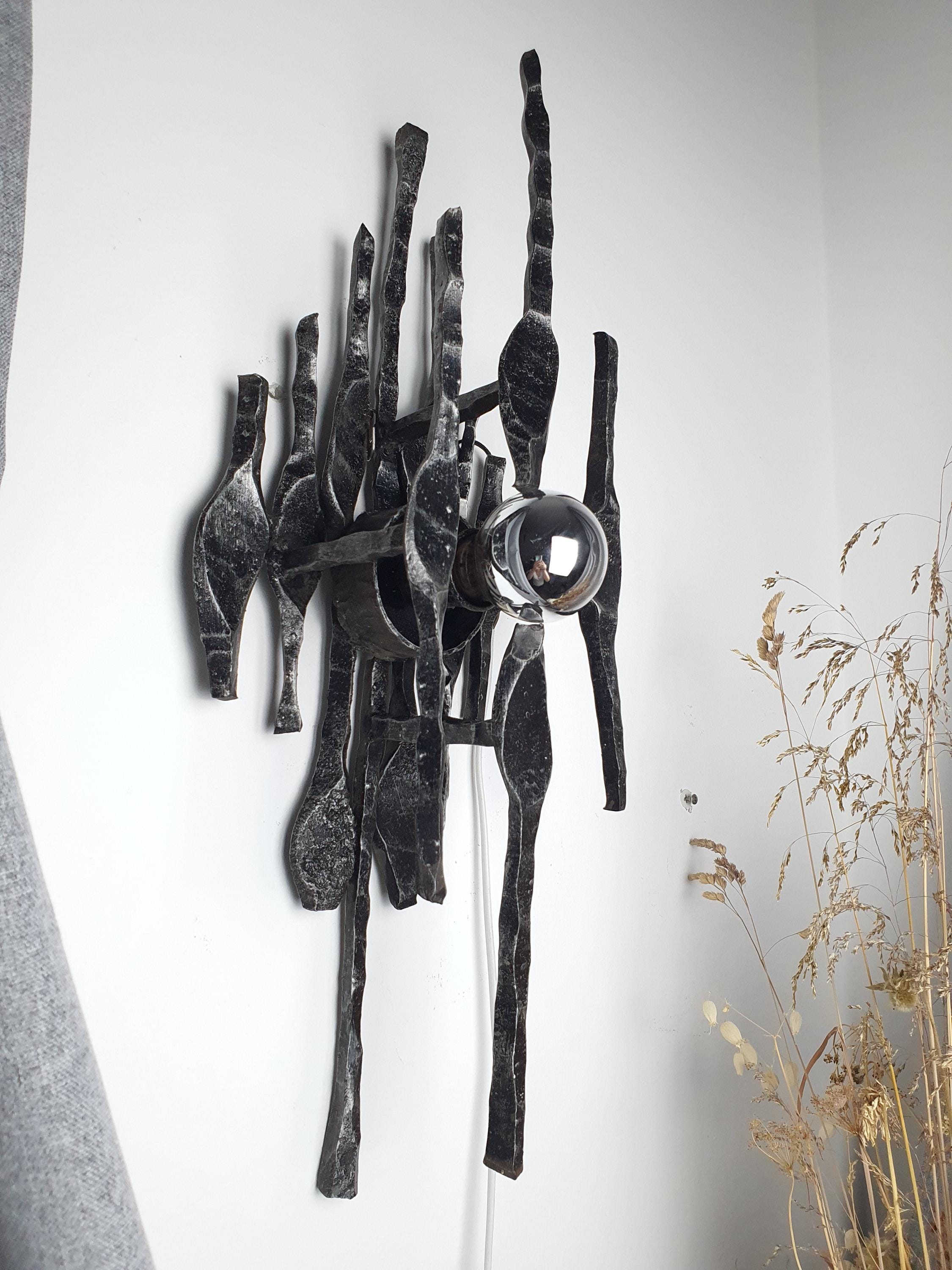 1970s wrought iron wall sconce side profile, textured metal surface and chrome detail
