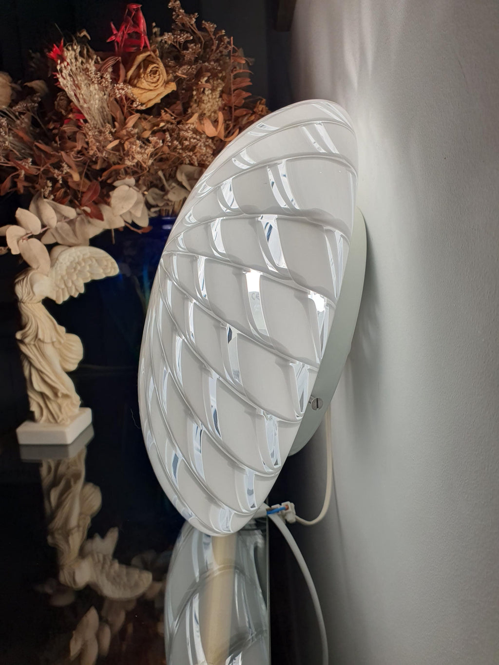Vintage Murano starburst flush mount as wall sconce, white and clear radiating pattern, minimalist MCM hallway