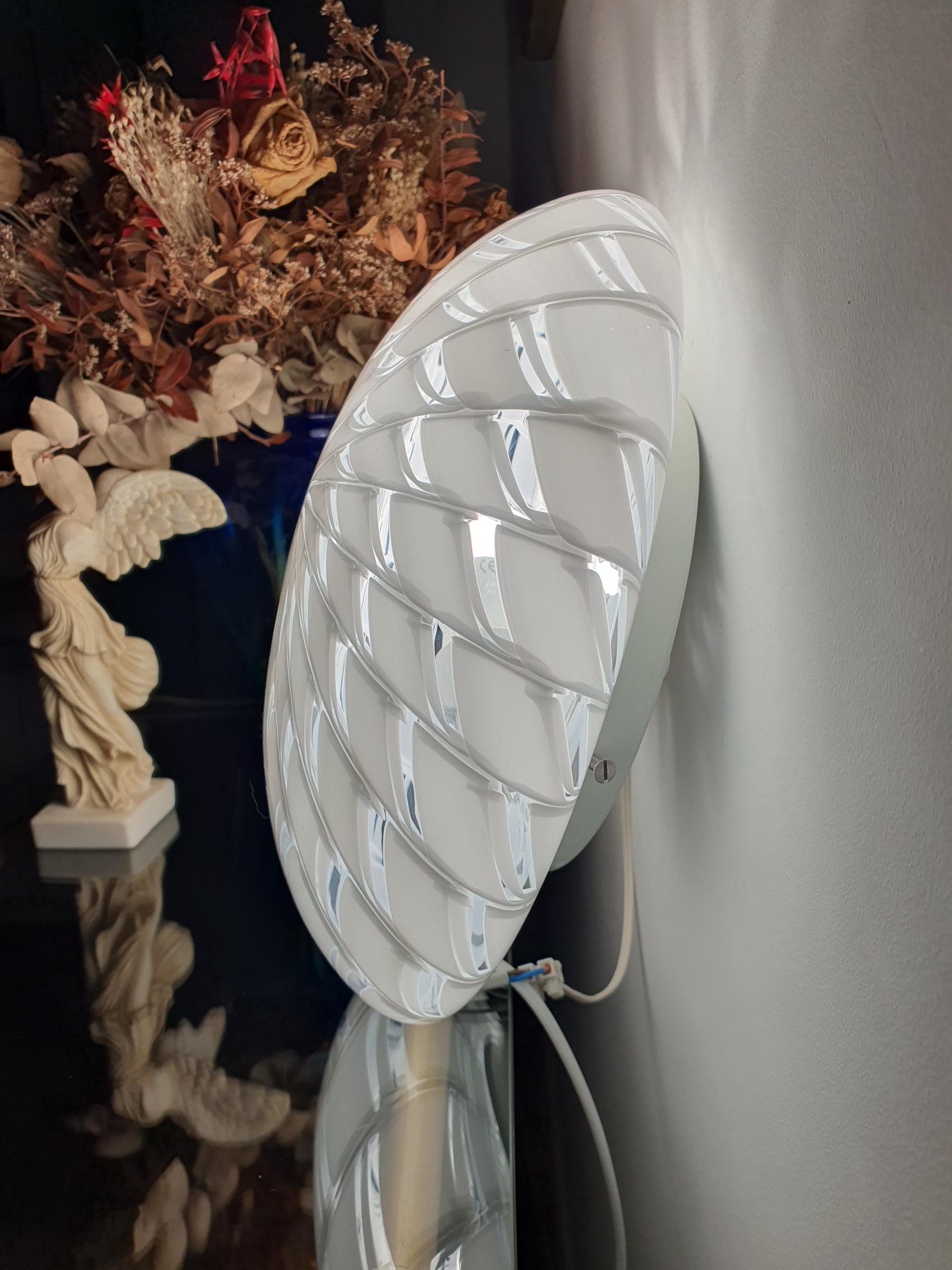 Vintage Murano starburst flush mount as wall sconce, white and clear radiating pattern, minimalist MCM hallway