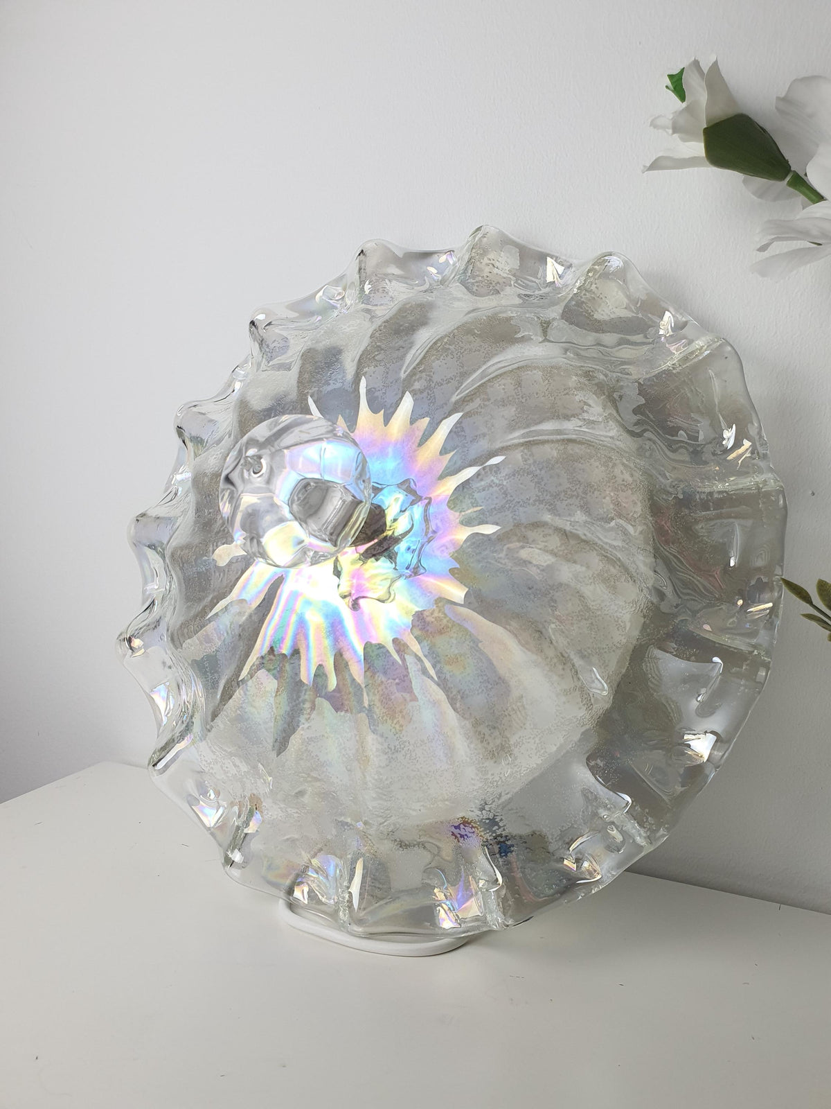 Pearlescent reflections across a shell-inspired Murano glass light
