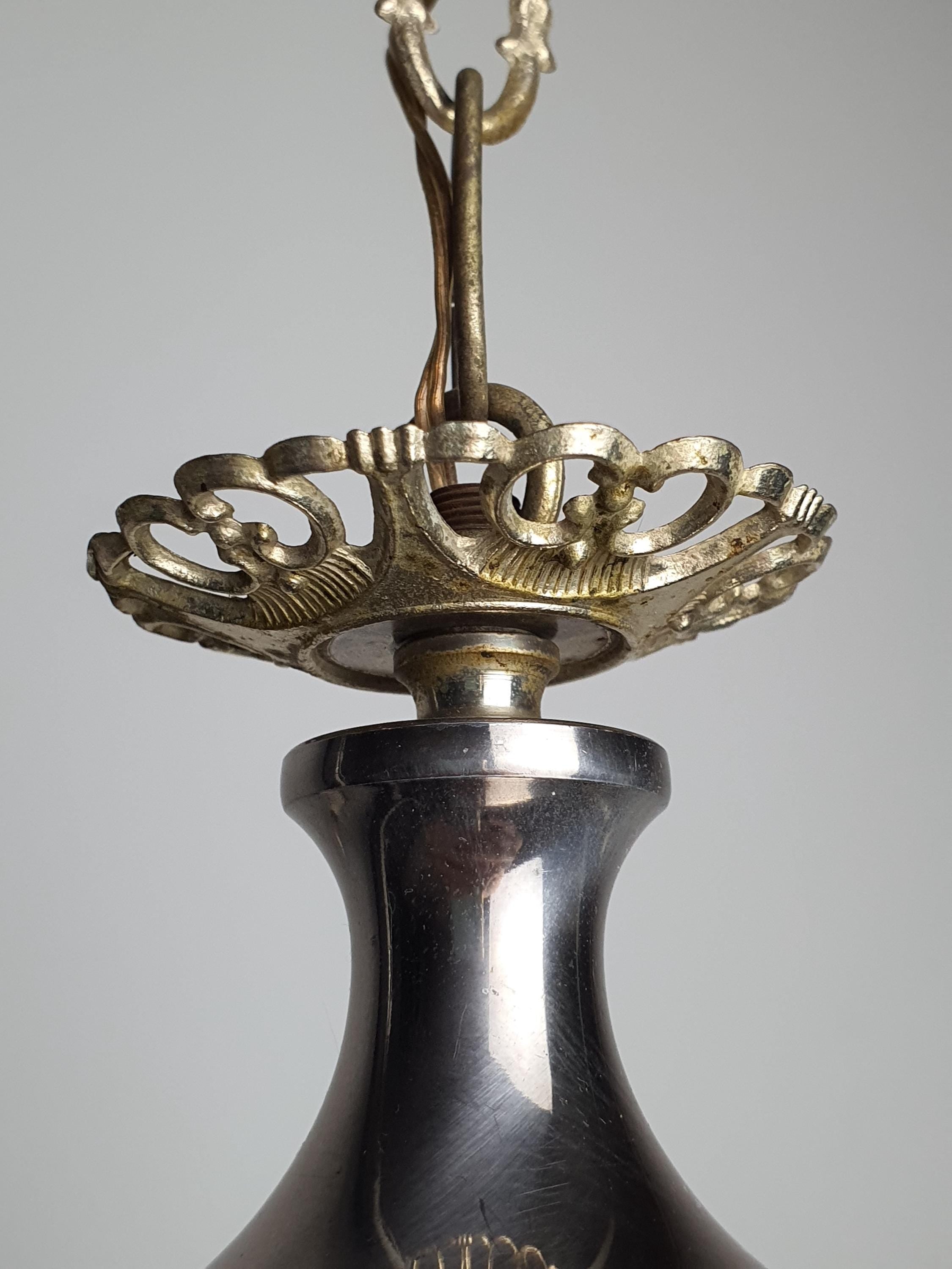 Detail of natural age wear and patina on silver-tone metal, vintage Italian 3-arm candle chandelier