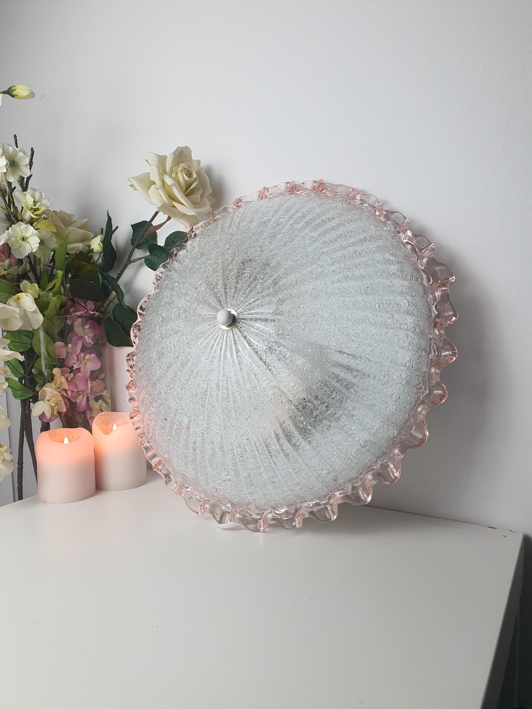 Murano floral flush mount front view, frosted shell relief pattern, pink rim, smooth luminous exterior, low-profile ceiling
