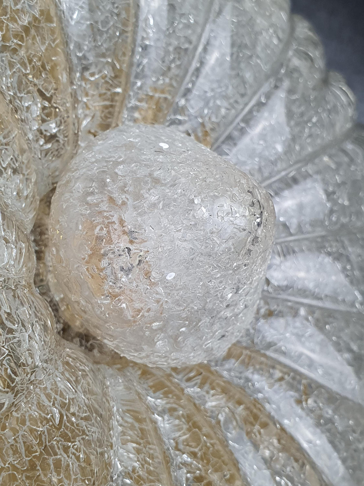 Decorative central glass element on a Murano flush-mount light

