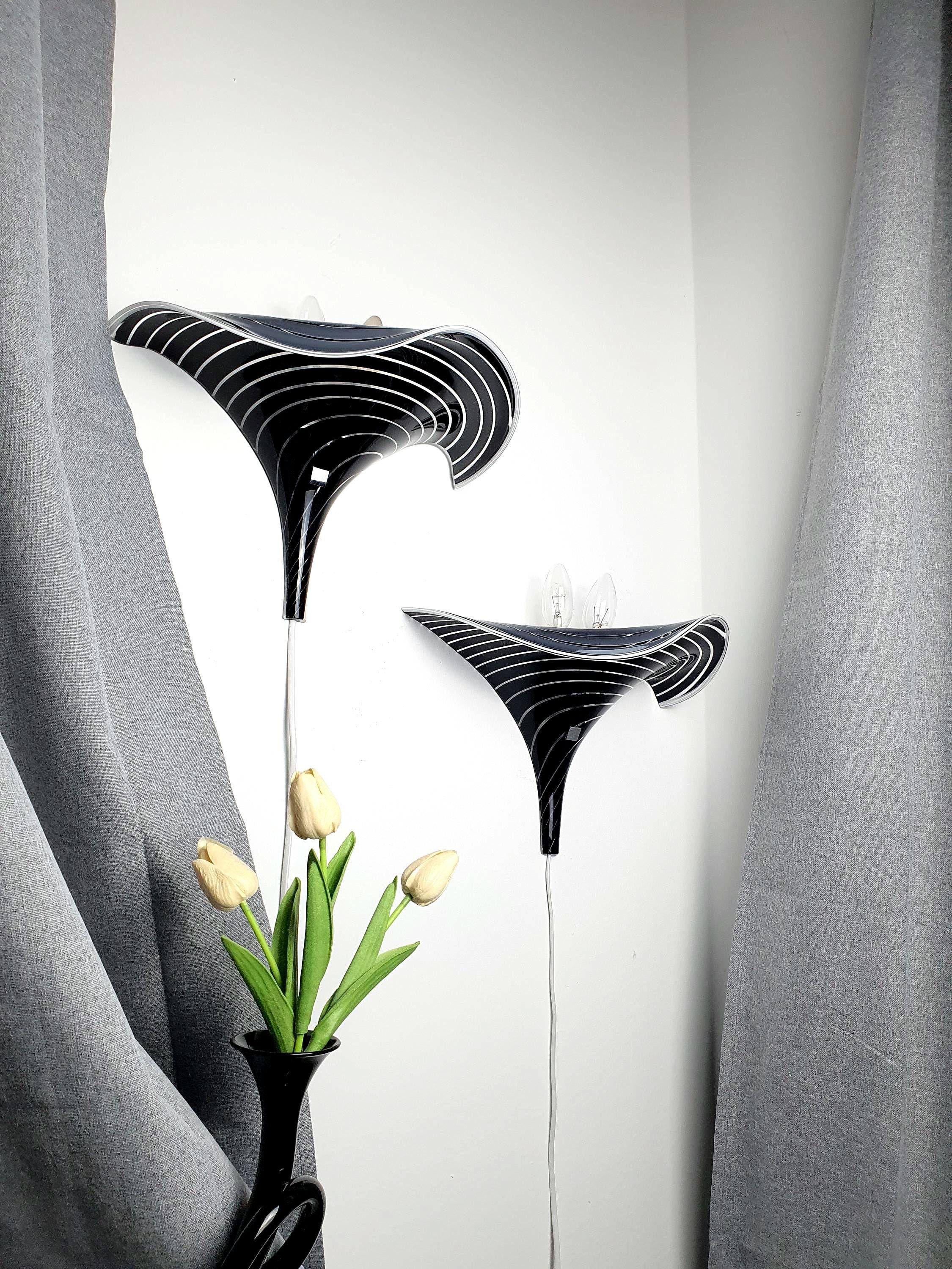 Pair of vintage Murano glass calla lily wall sconces, black and clear zebra stripe layered art glass, wave silhouette, Italy 1960s–1980s