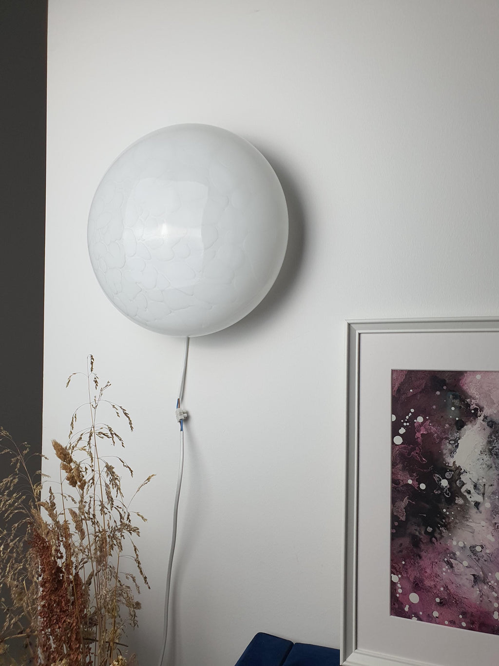 
Vintage Murano glass flush mount installed as wall sconce, white spotted layered glass, bedroom setting