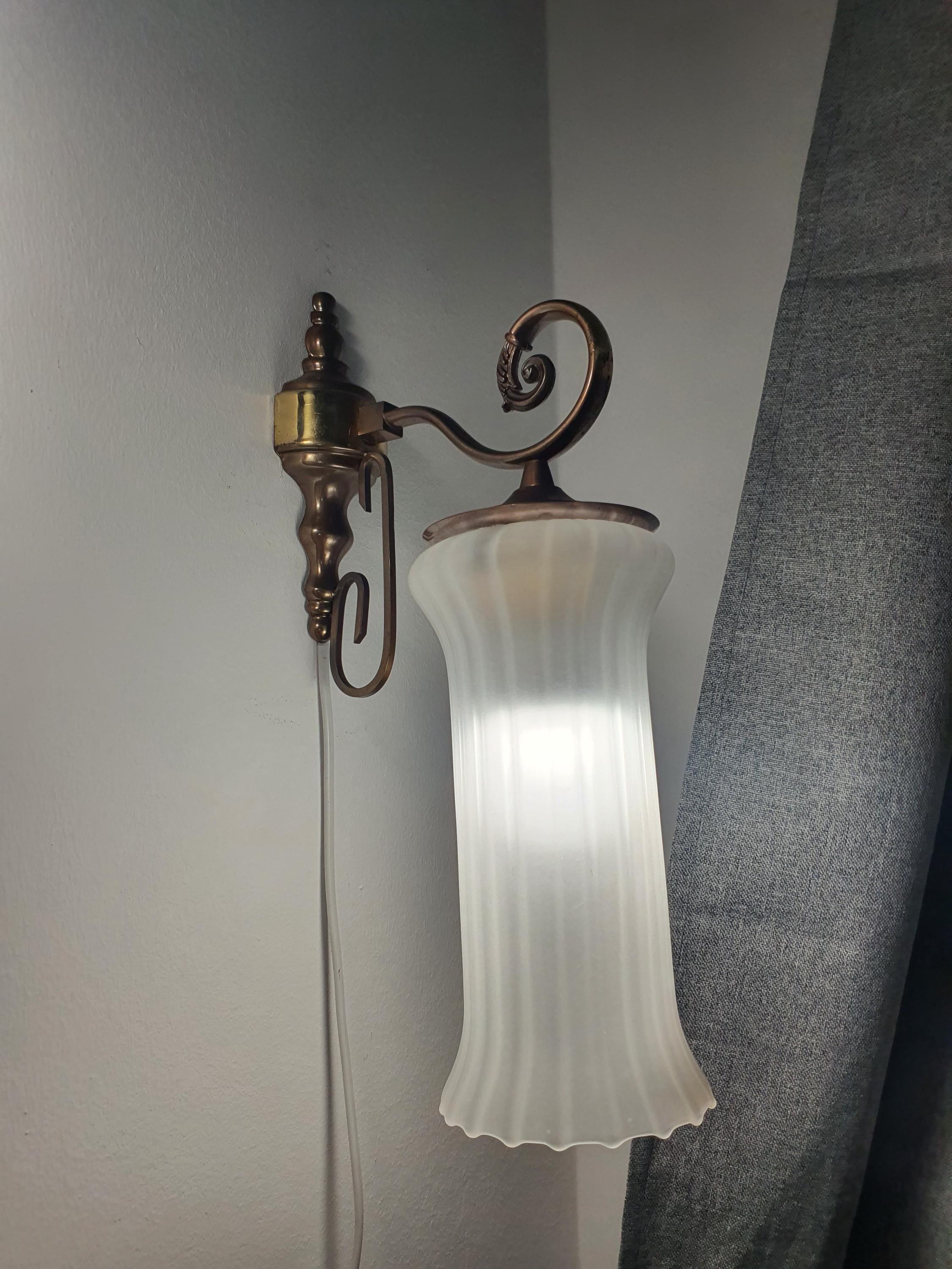 Vintage Italian satin frosted flute wall sconce facing downward, showing reversible hook mount installation, brass base