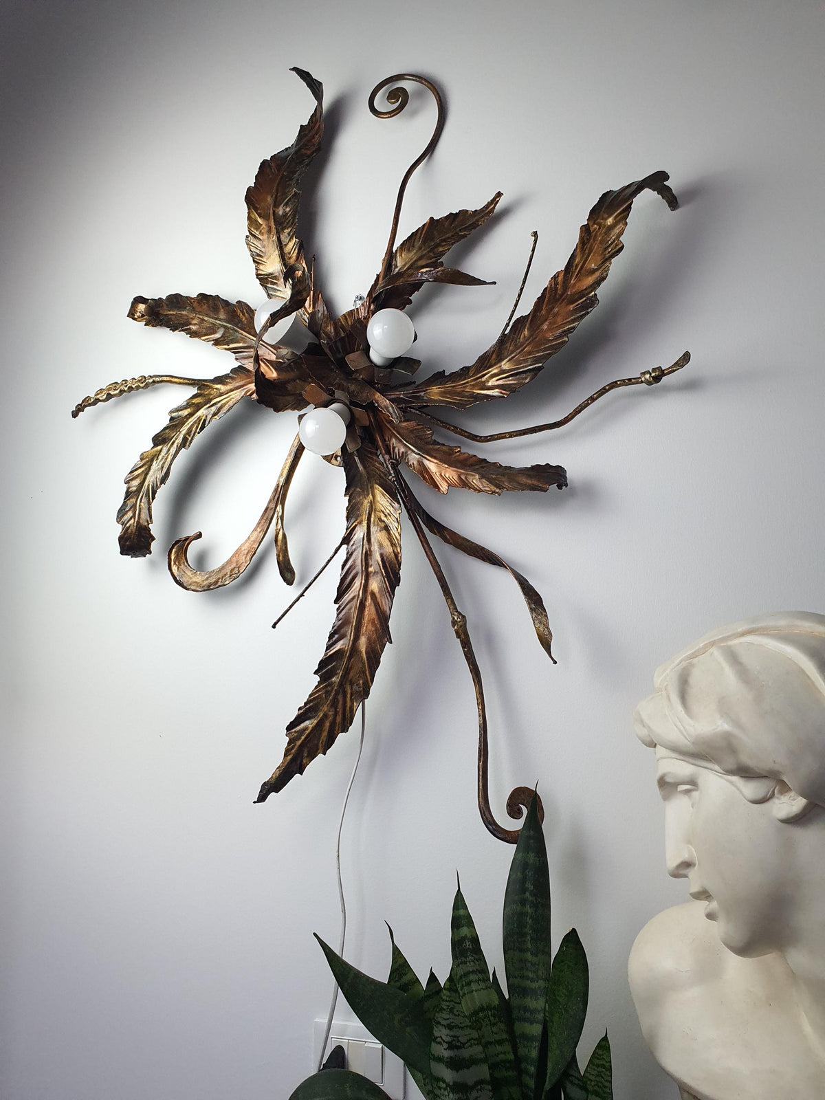 Branch-inspired composition on an oversized 1980s Italian metal light
