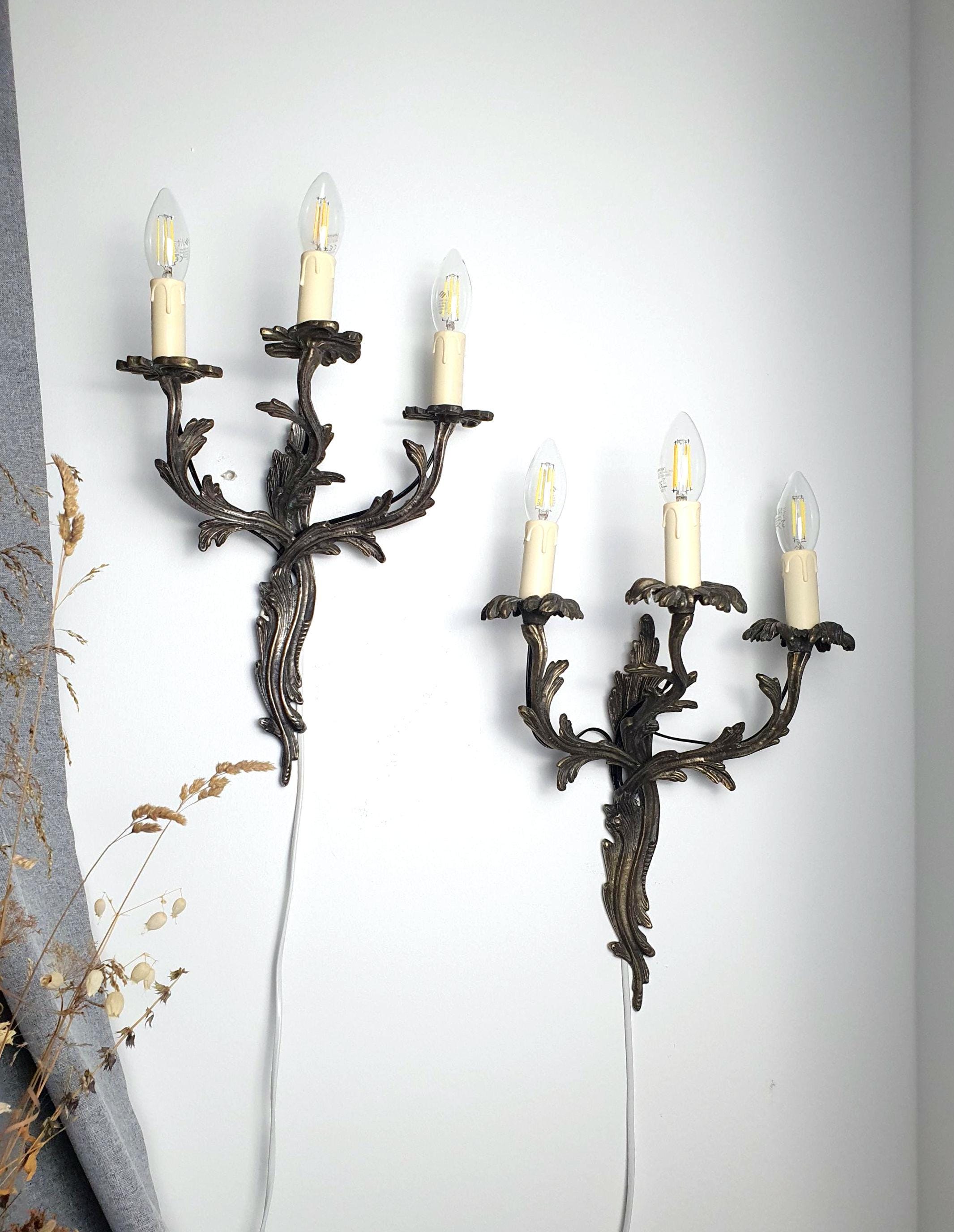 Pair of handcrafted Gothic wall sconces — 3-arm candle style, dark grey metal, front view