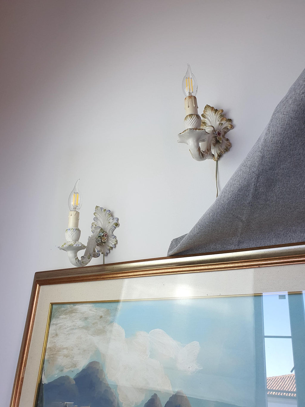 Minor age-related wear on a vintage ceramic candle-style wall light
