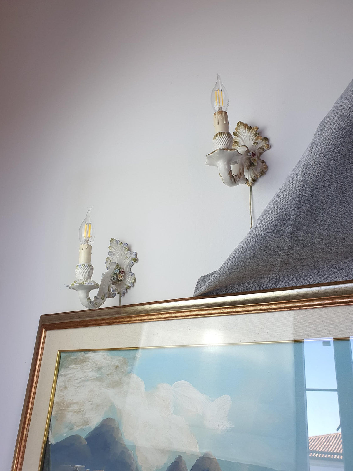 Minor age-related wear on a vintage ceramic candle-style wall light

