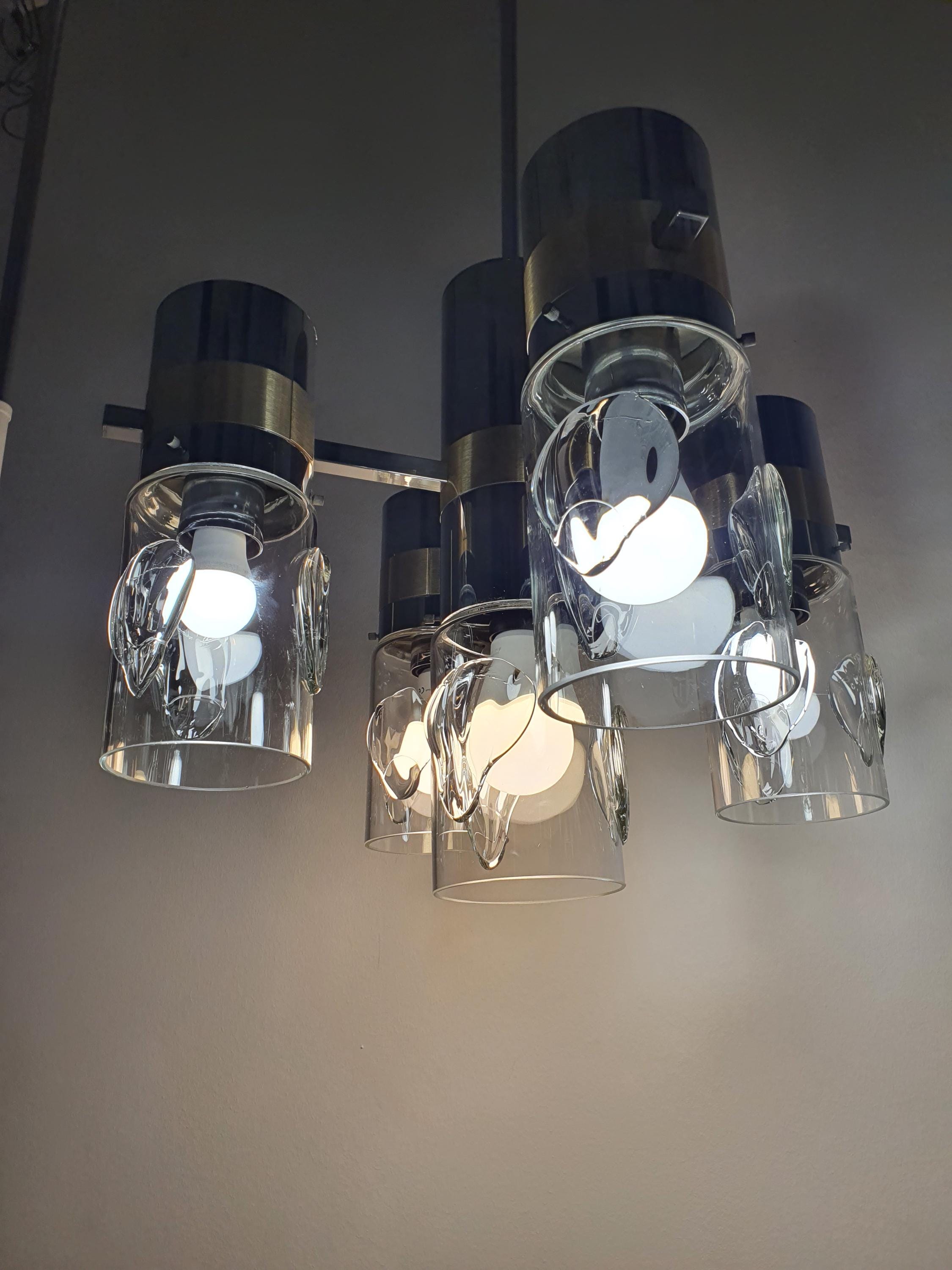 Close-up of handcrafted glass diffuser on vintage Space Age Sputnik chandelier, soft light diffusion, chrome gold arm detail