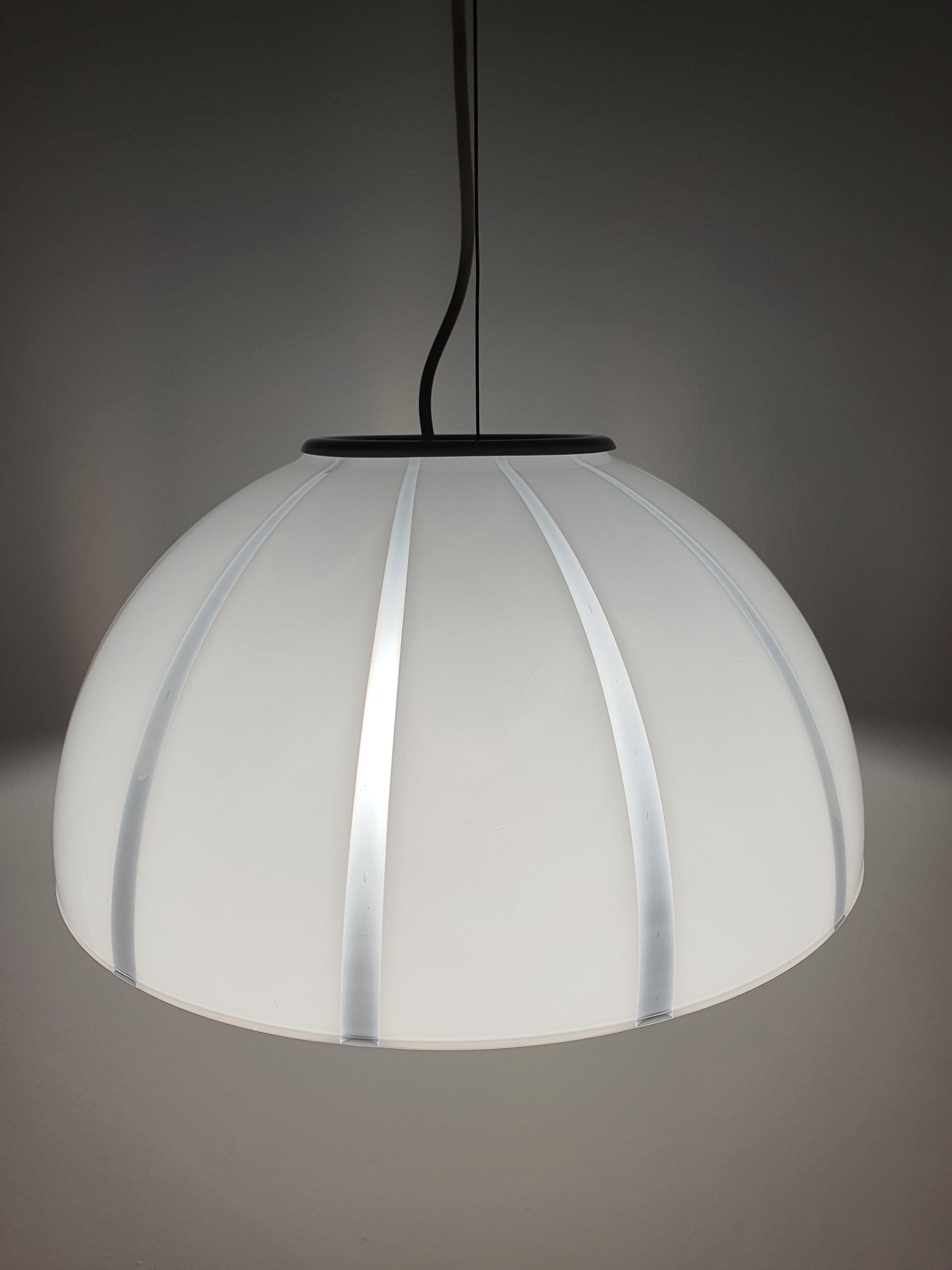 Murano bell pendant front view, white and clear striped glass, subtle layered stripe effect, gold-toned canopy, minimalist MCM