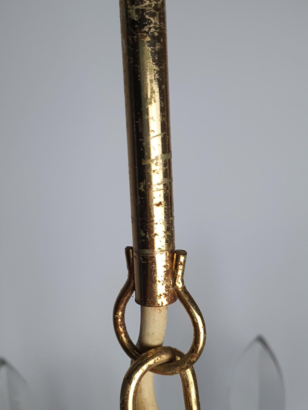 Vintage Sciolari-attributed brass chandelier unlit, showing double-wave arm silhouette and crystal drop texture