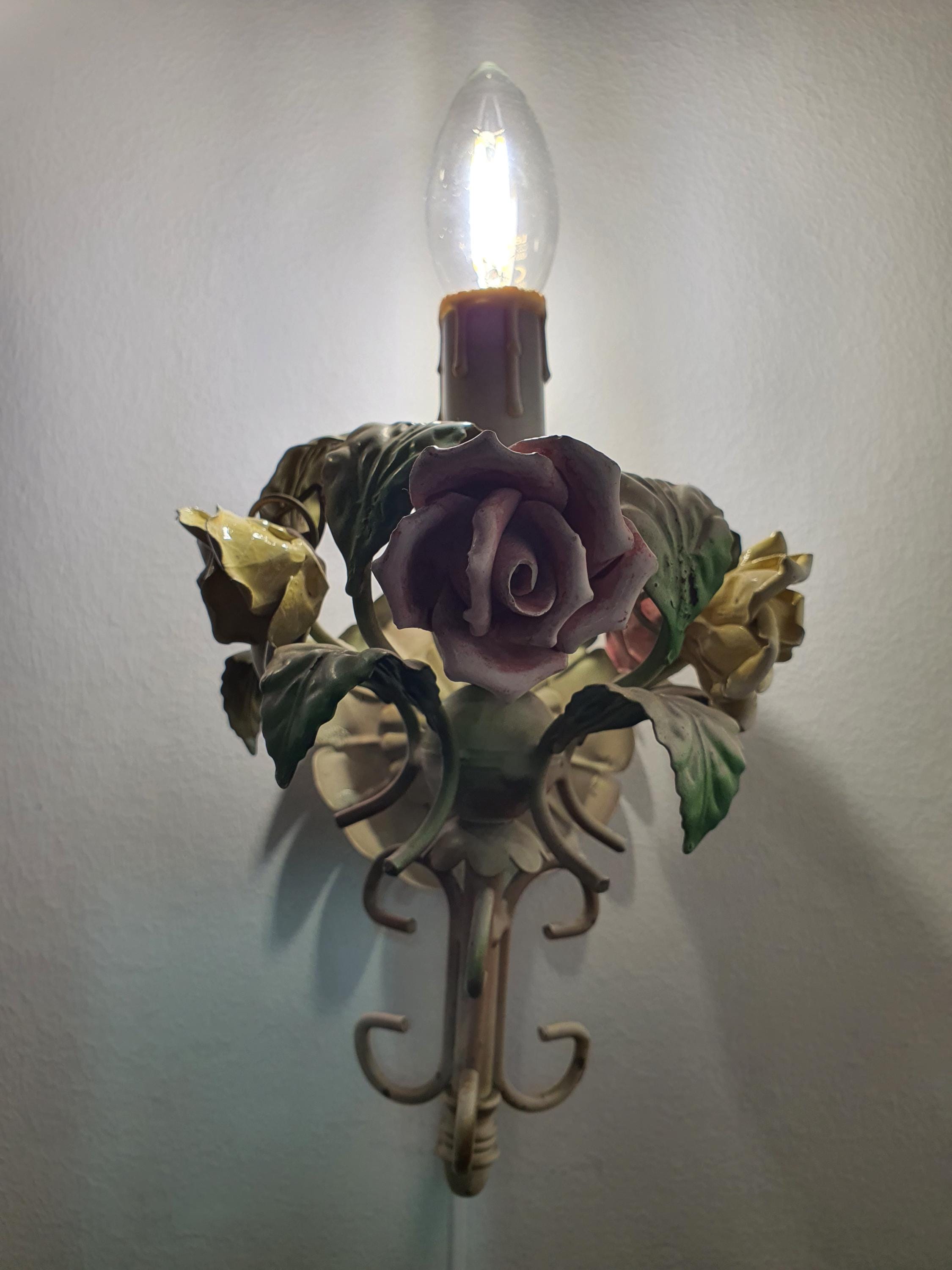 Vintage tole wall sconce — floral porcelain and green metal arm detail