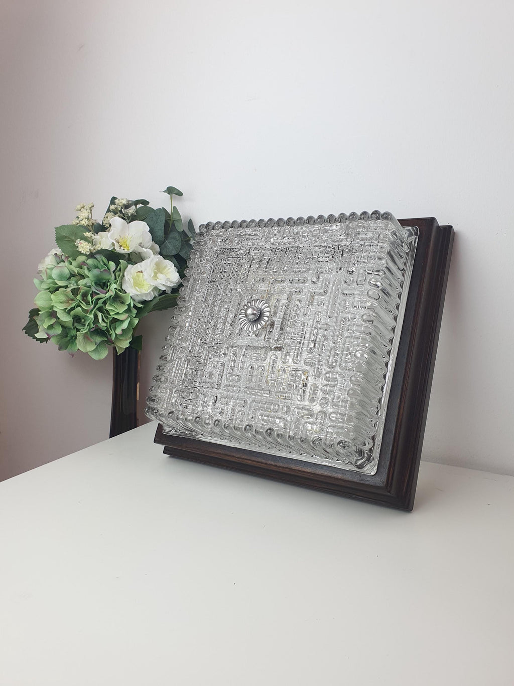 Vintage Italian square Brutalist light unlit, showing geometric ribbed glass silhouette and warm wood frame surround
