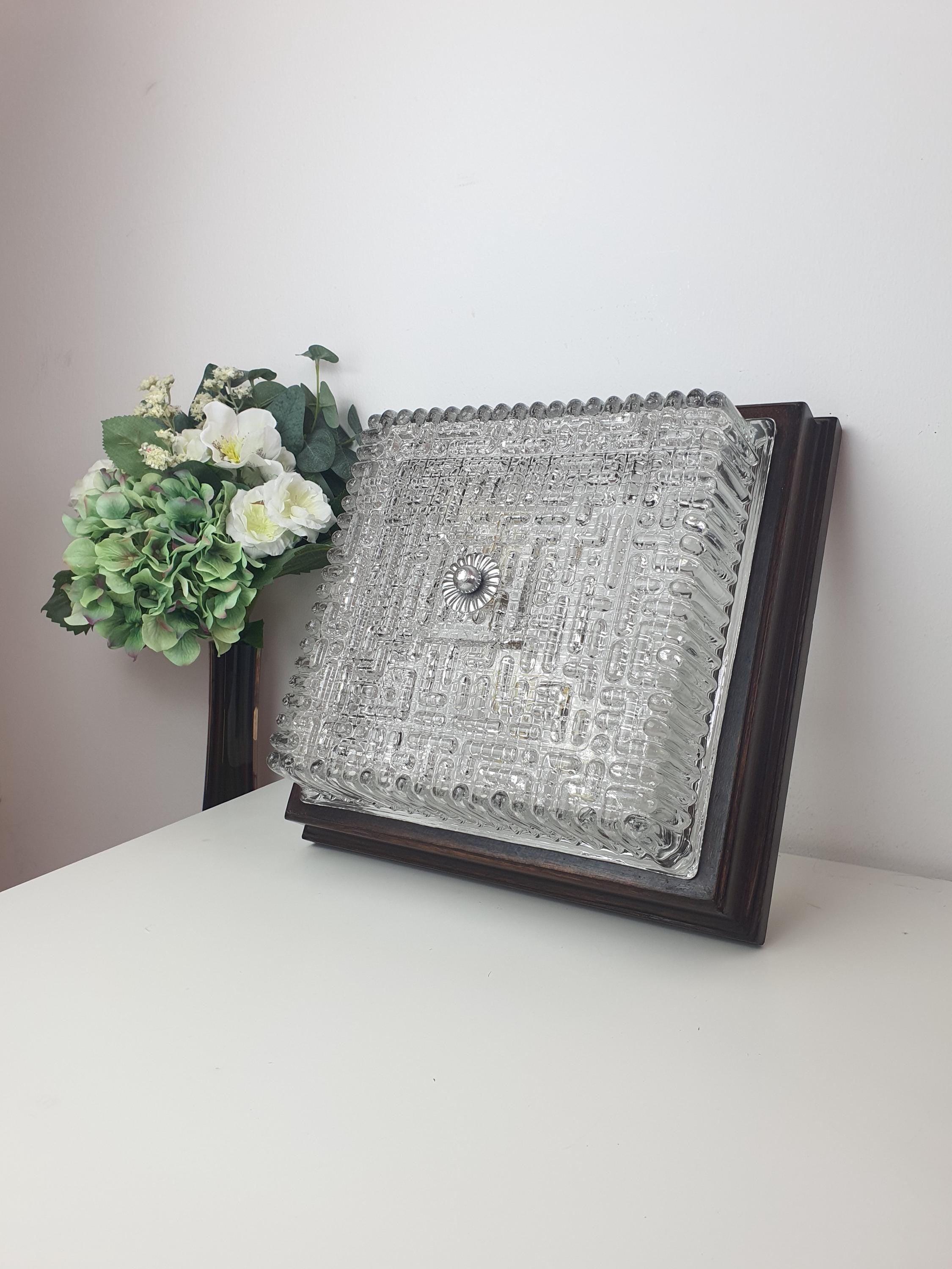 Vintage Italian square Brutalist light unlit, showing geometric ribbed glass silhouette and warm wood frame surround