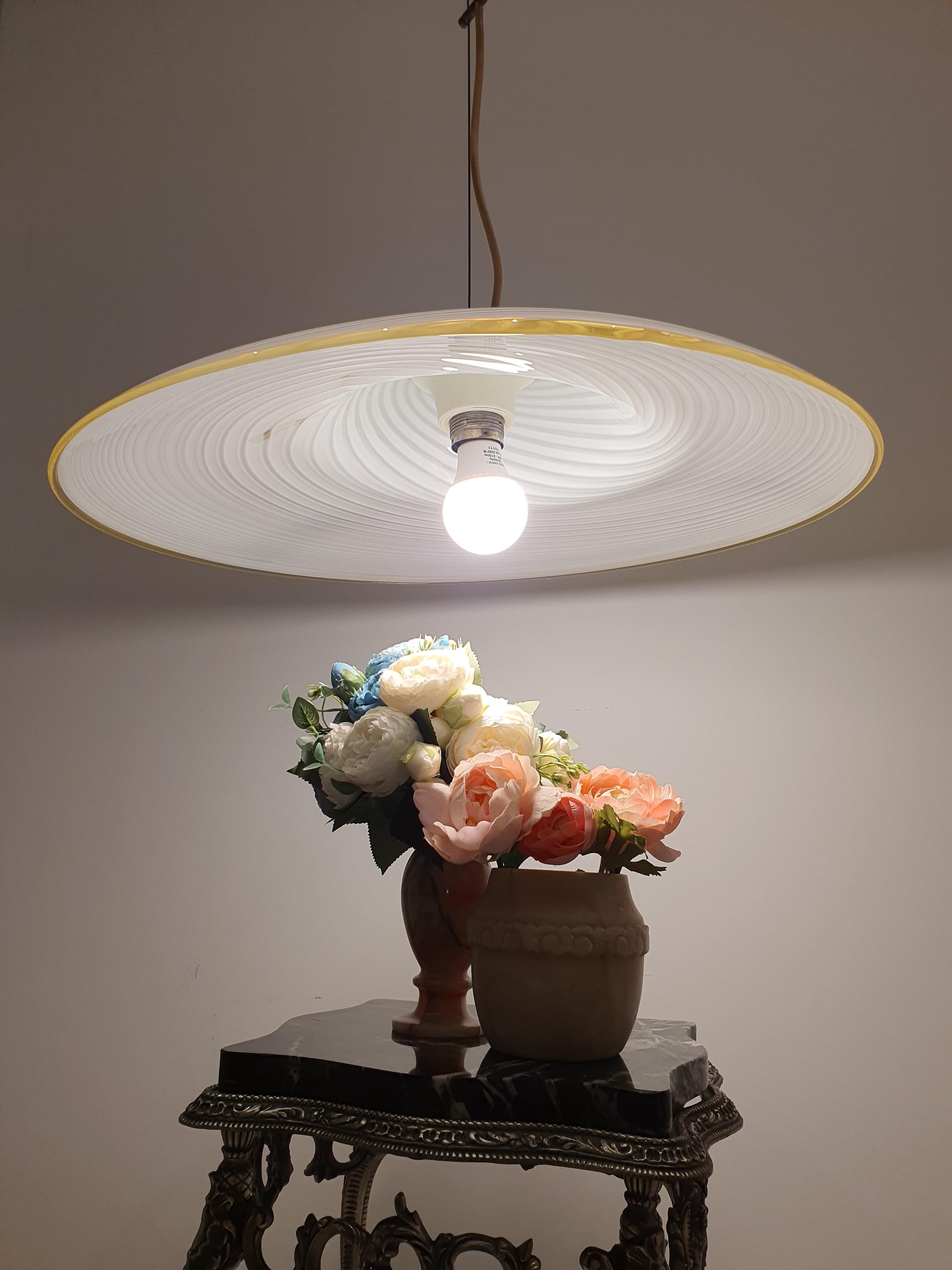 Murano white swirl pendant — wide shallow disc form, W56×H15cm, kitchen table setting