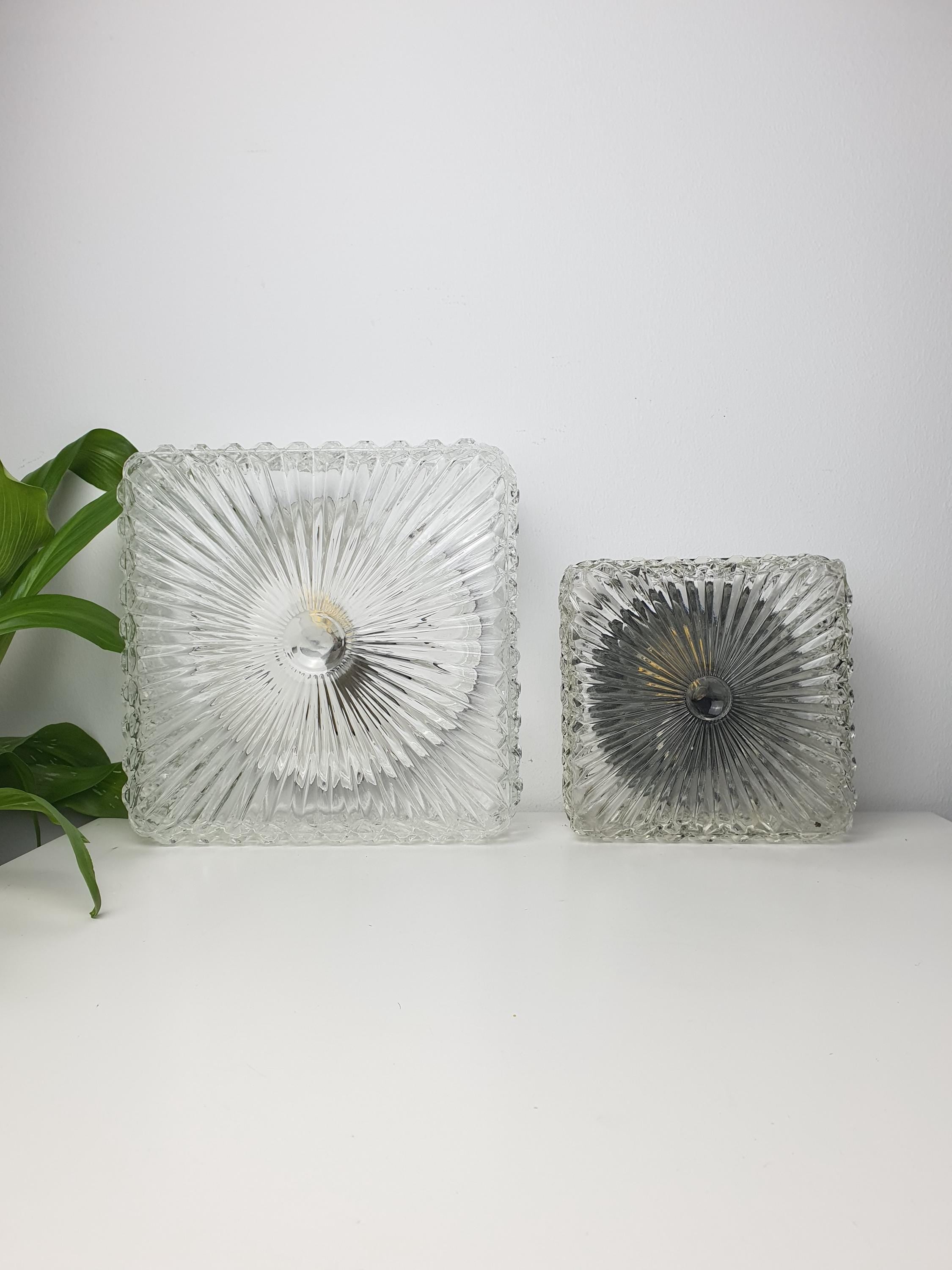 Set of 2 Brutalist MCM Midcentury wall sconces in stamped clear glass