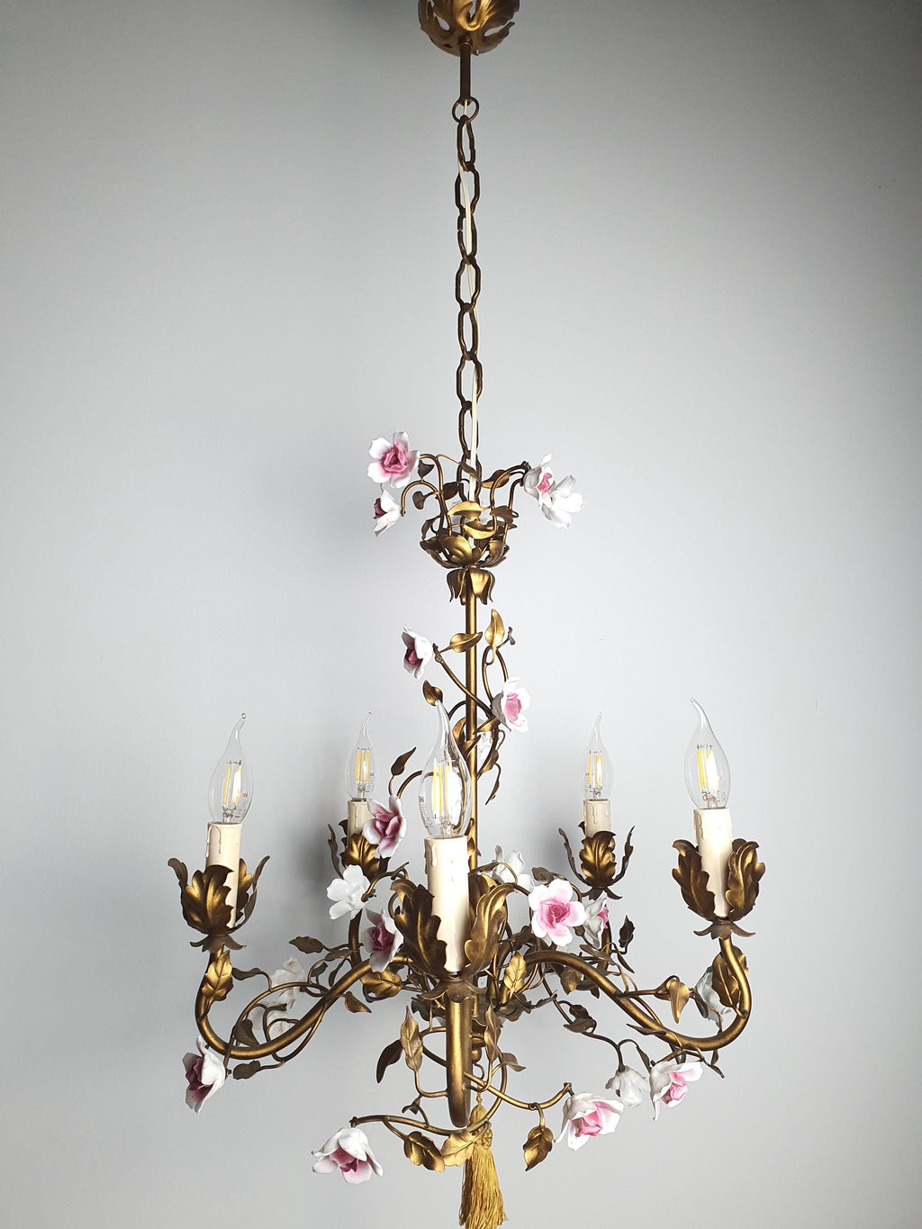 Italian floral chandelier with bronze-toned metal leaves and curling branches
