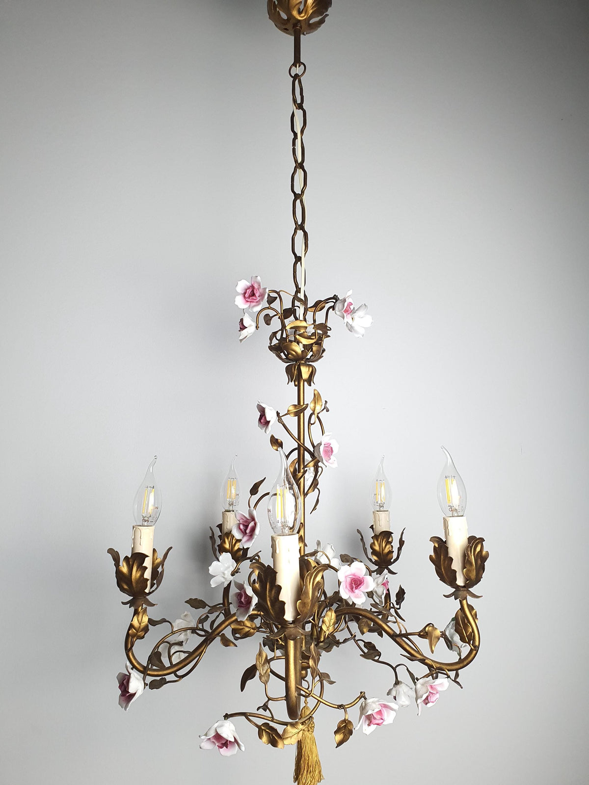 Italian floral chandelier with bronze-toned metal leaves and curling branches
