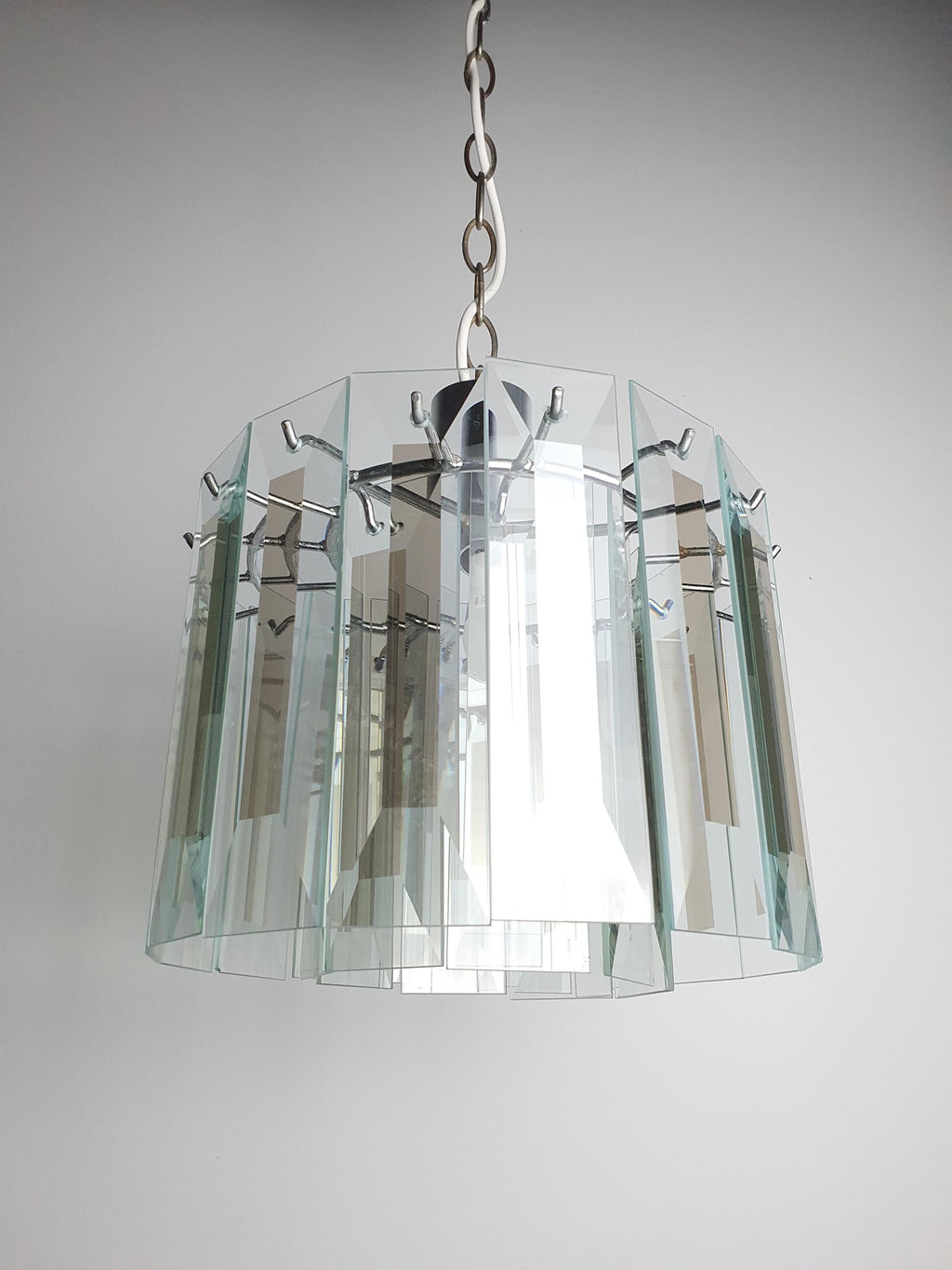 Vintage Art Deco chandelier in powder room, crystal petal sparkle, chrome, compact geometric Art Deco French glamour