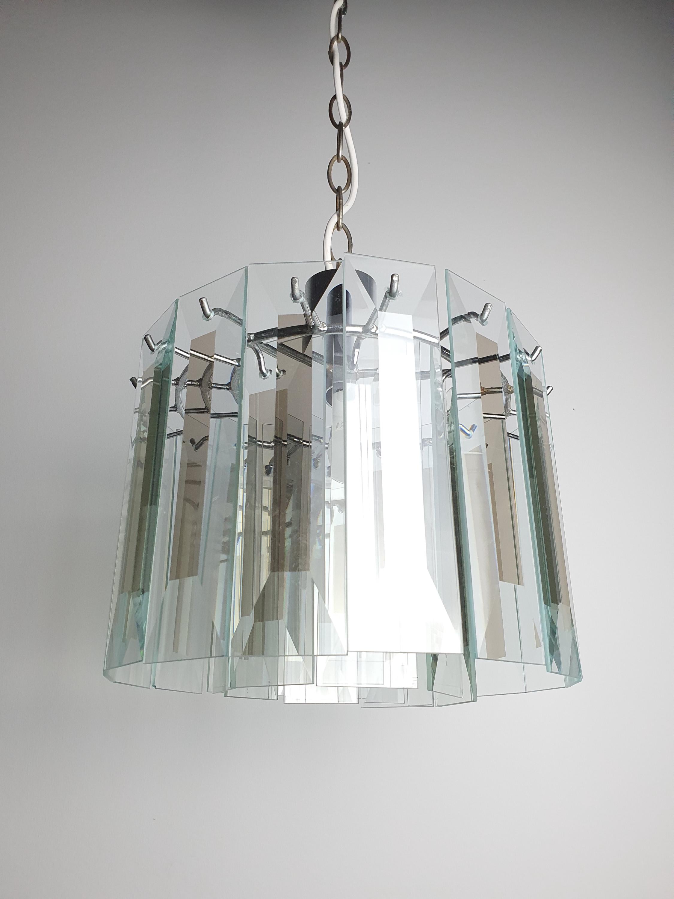 Vintage Art Deco chandelier in powder room, crystal petal sparkle, chrome, compact geometric Art Deco French glamour