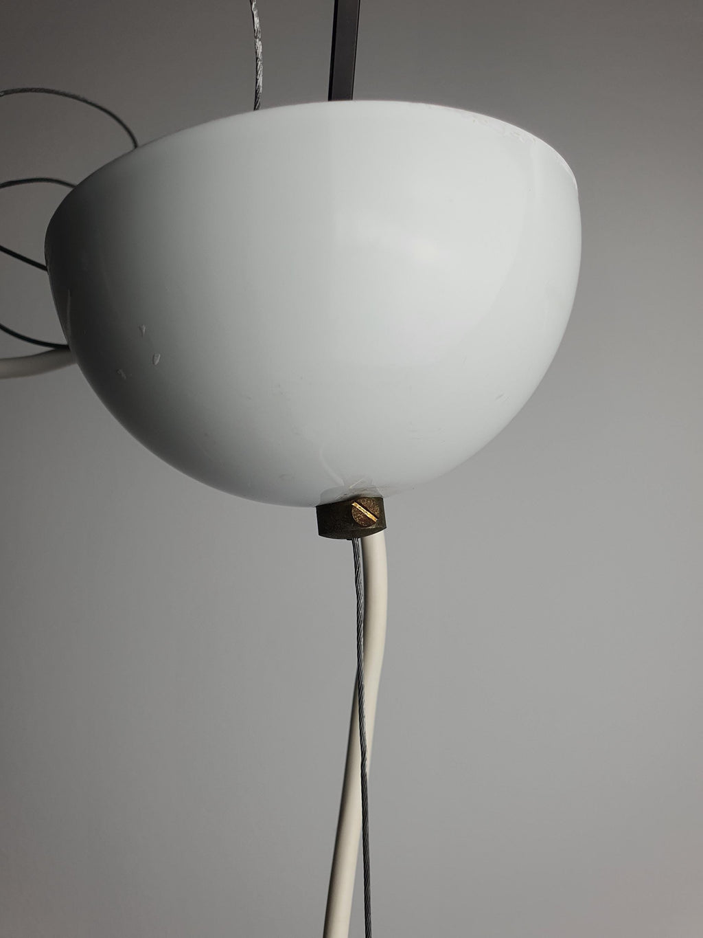 Detail of satin white surface with trapped air bubbles, vintage Murano glass Fazzoletto pendant