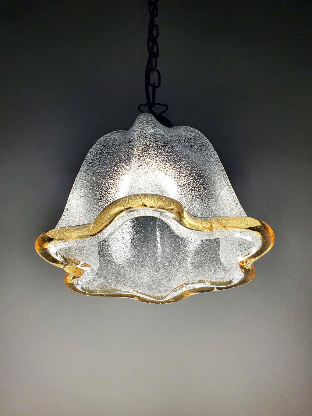 Vintage Murano glass bell tulip pendant, graniglia icy glass interior, smooth glossy exterior, yellow accent rim, bronze chain, Italy 1970s