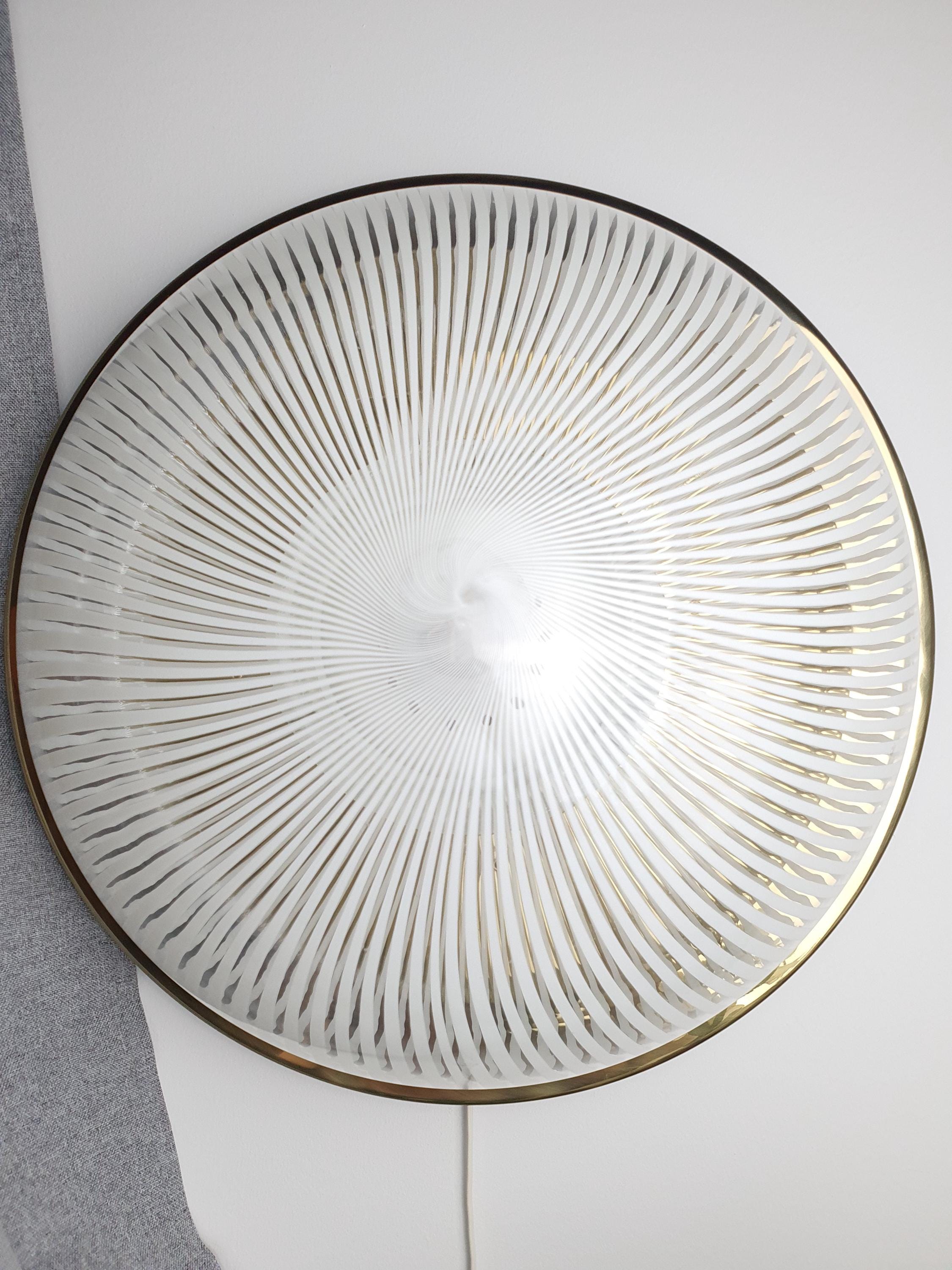 Close-up of Venini filigrana white filigree lines suspended in clear Murano glass shade
