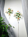 Pair of vintage 1970s Italian tole wall sconces, white green and orange painted metal floral design, Bohemian MCM, Italy