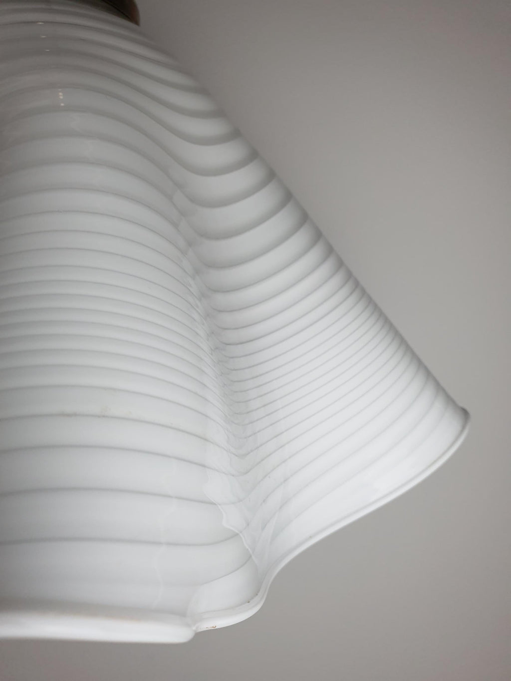 Vintage Murano fazzoletto pendant — swirled glass texture catching light, detail