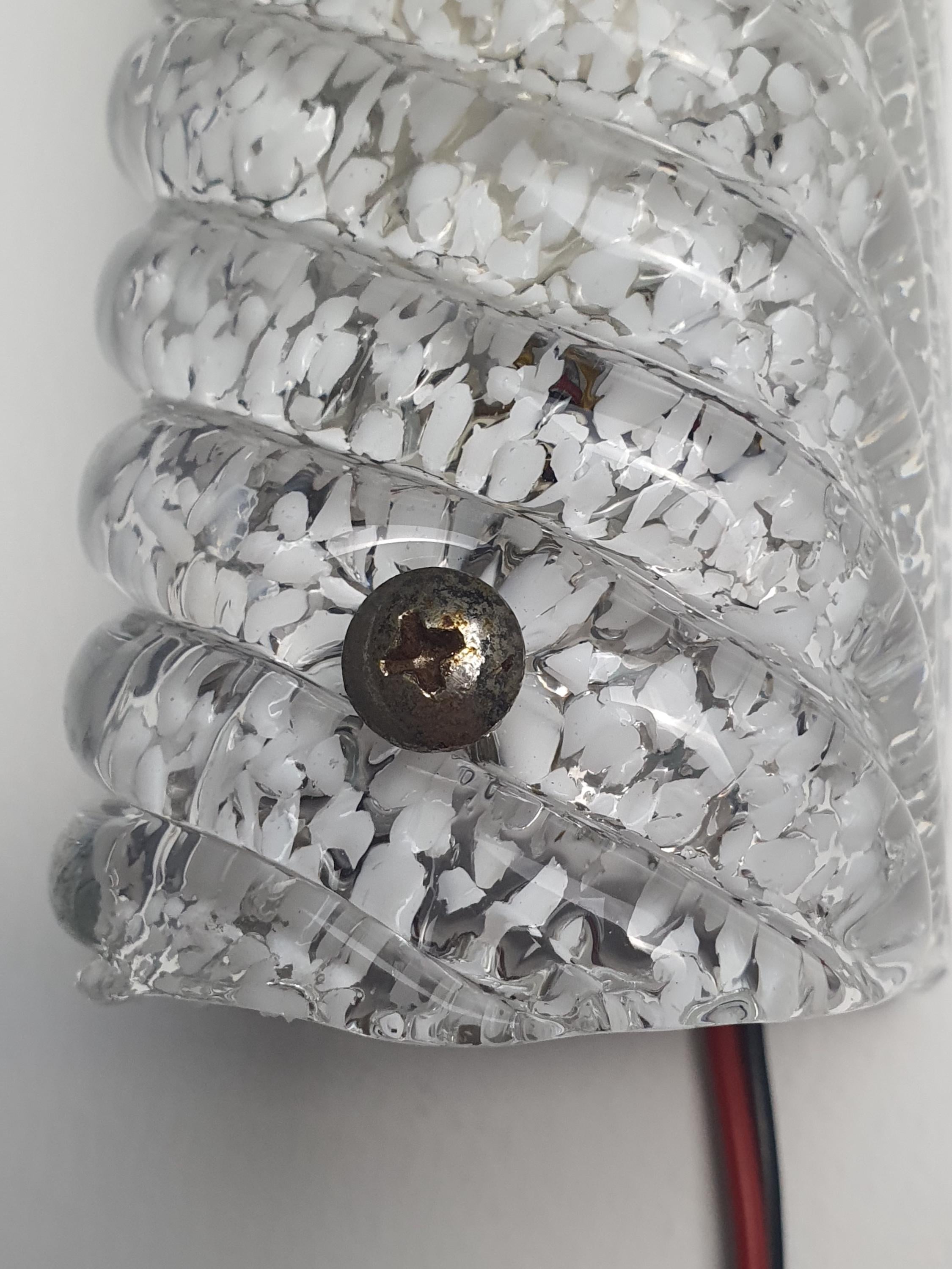 Set of 2 vintage Murano ribbed sconces lit, icy crystalline glow through clear and white inclusion glass