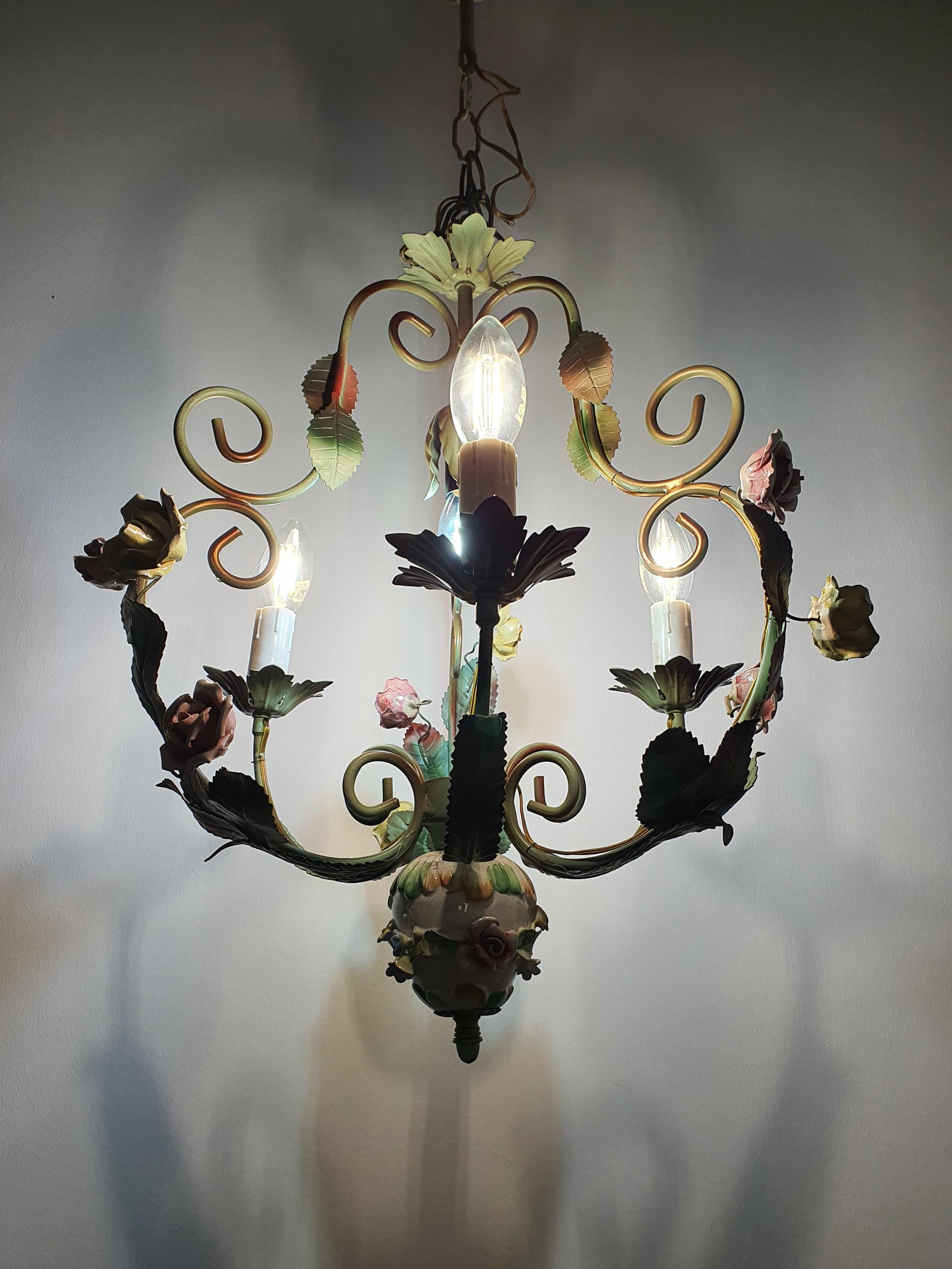 Vintage Italian tole chandelier installed in bedroom, romantic Mediterranean style