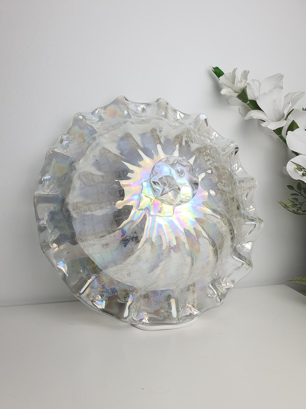 Clear Murano glass with shifting pink, green, blue and petrol reflections
