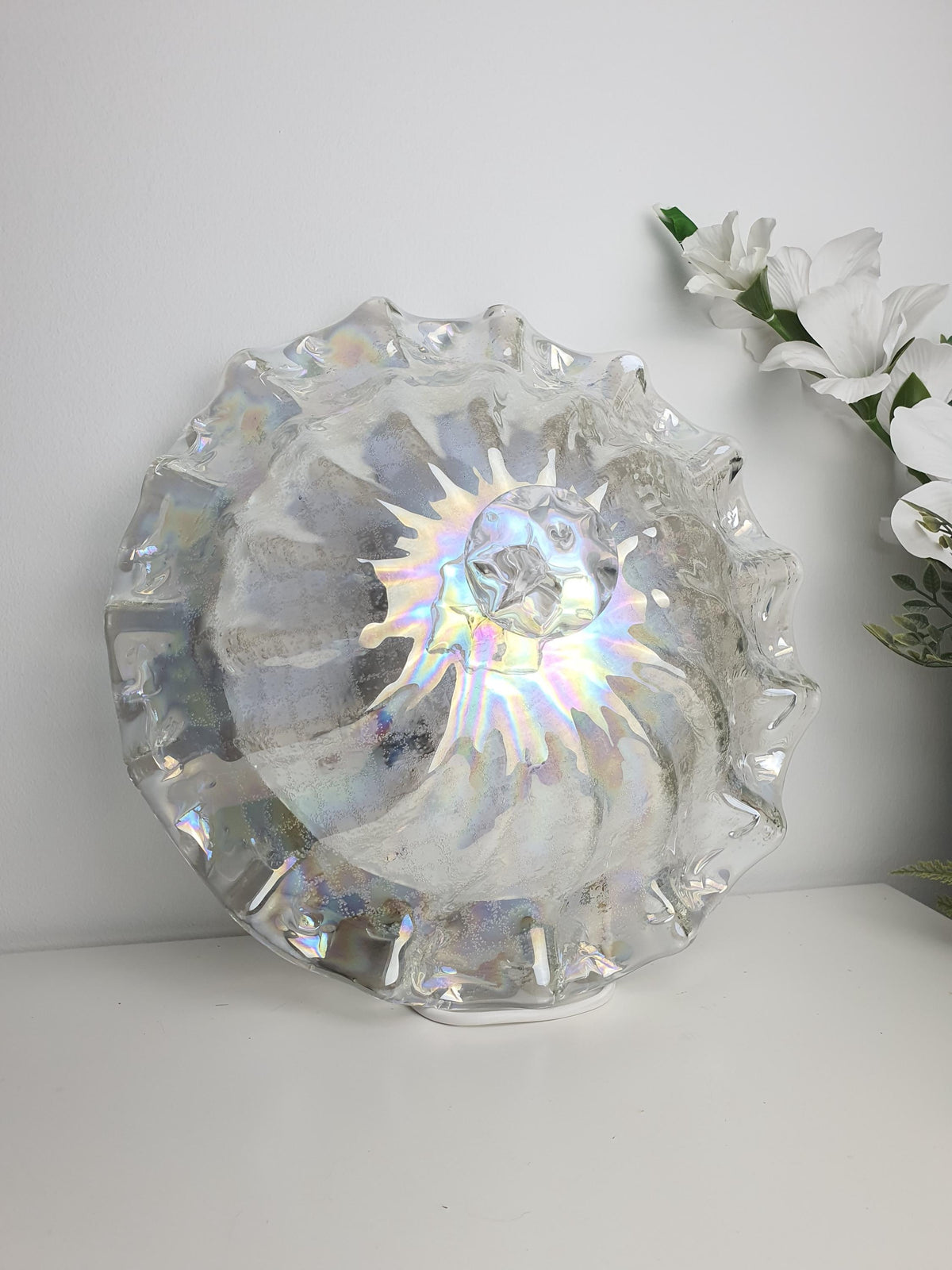 Clear Murano glass with shifting pink, green, blue and petrol reflections
