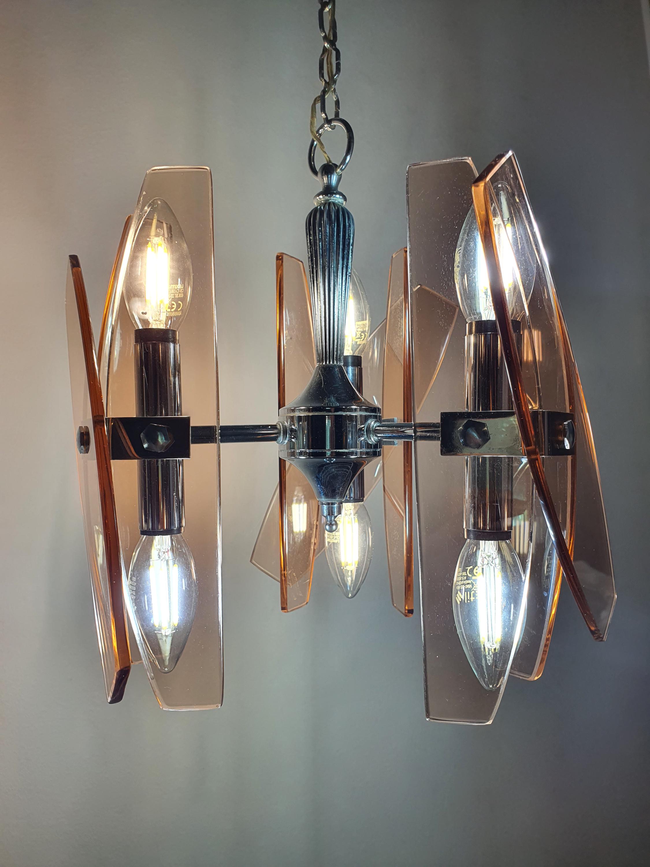 Vintage Veca Italian chandelier — illuminated, warm pink glow from all 6 light points