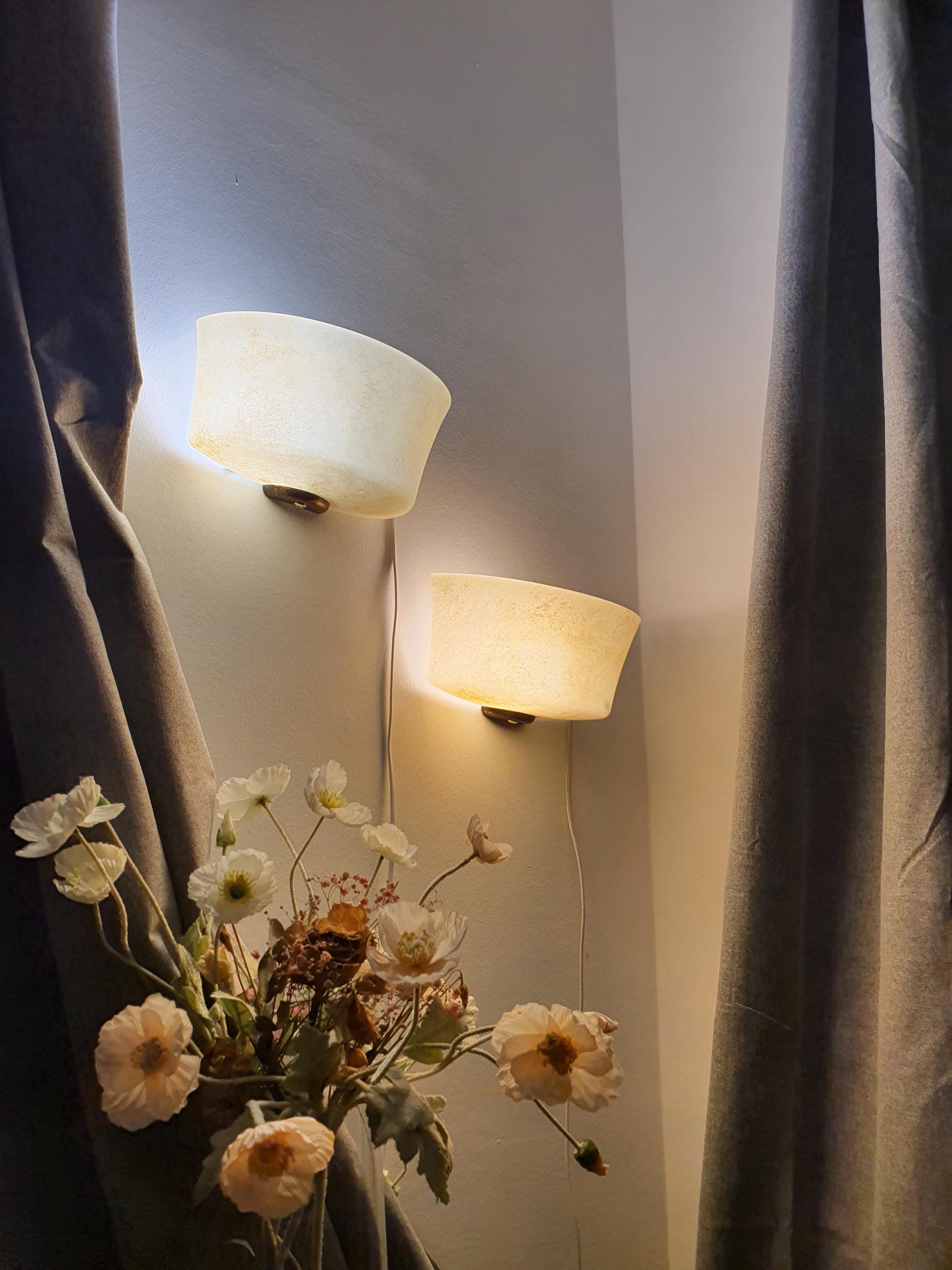 Pair of vintage Italian MCM moonstone glass wall sconces in warm sand tone, half-bowl shape