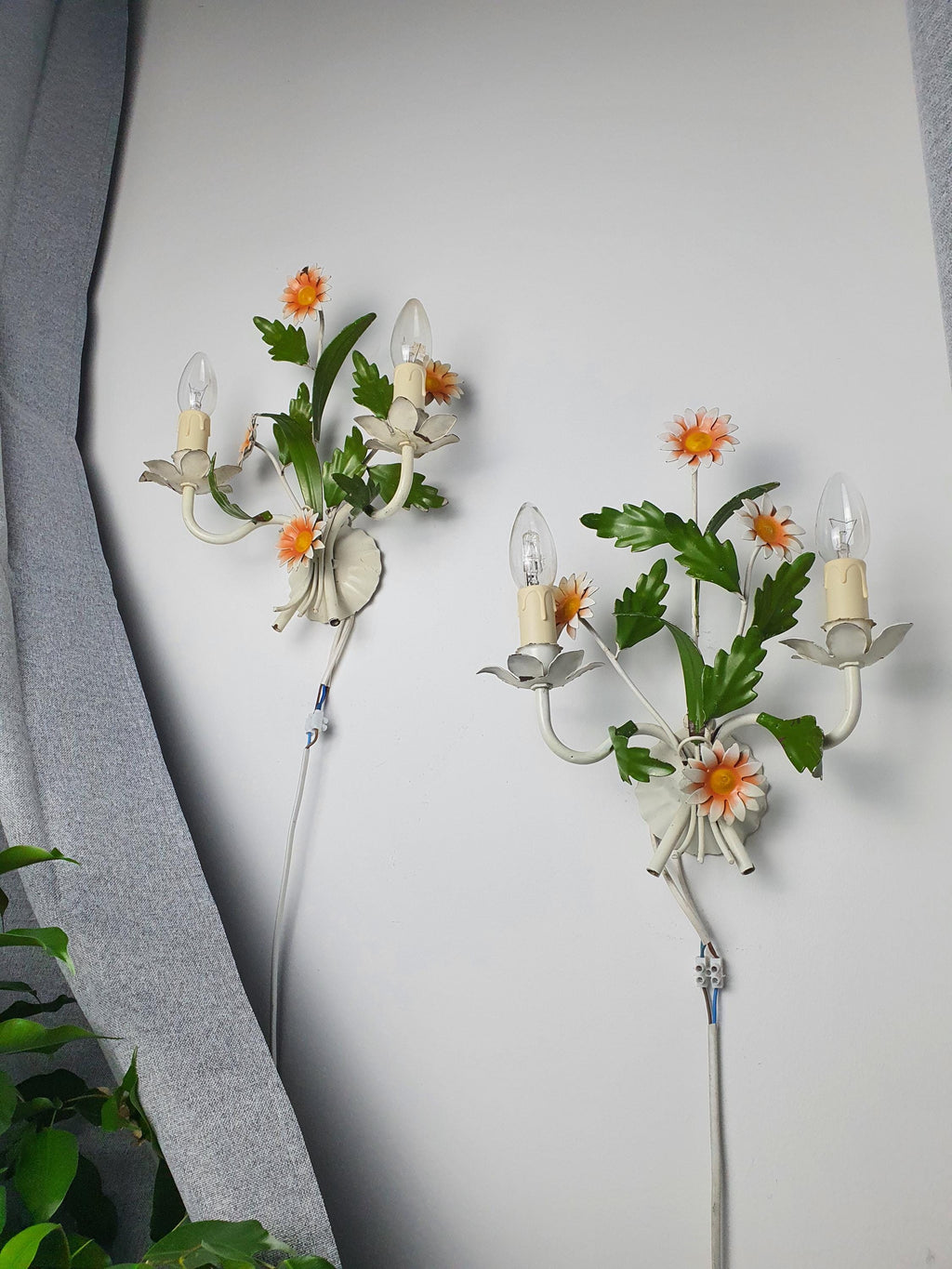 Vintage 1970s Italian tole wall sconce front view, white green orange painted metal flowers and foliage, sculptural floral form
