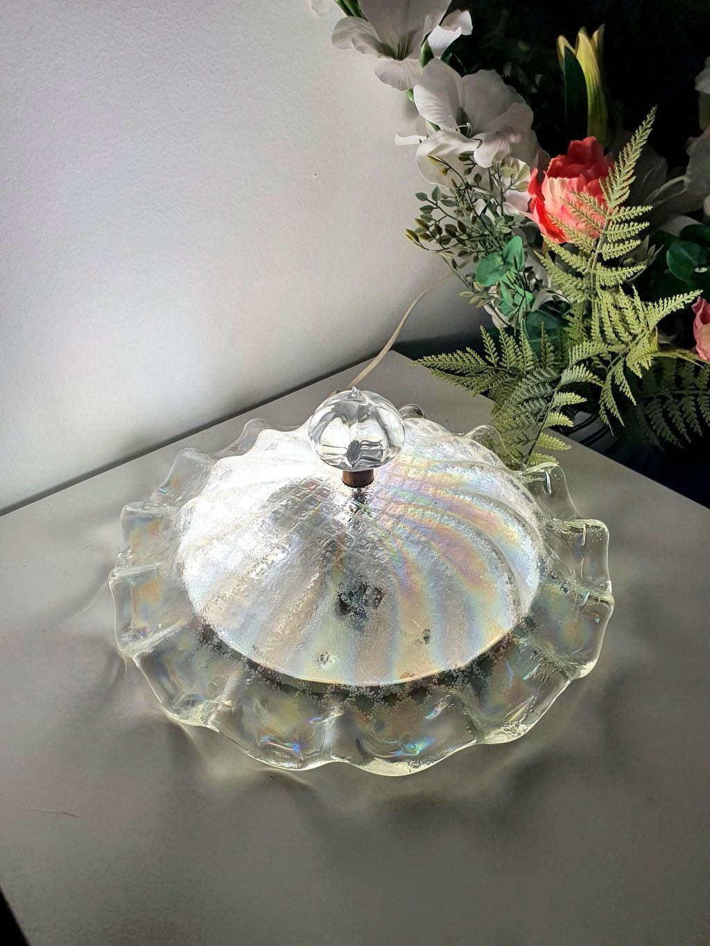 Flowing floral silhouette of a vintage Italian glass ceiling light

